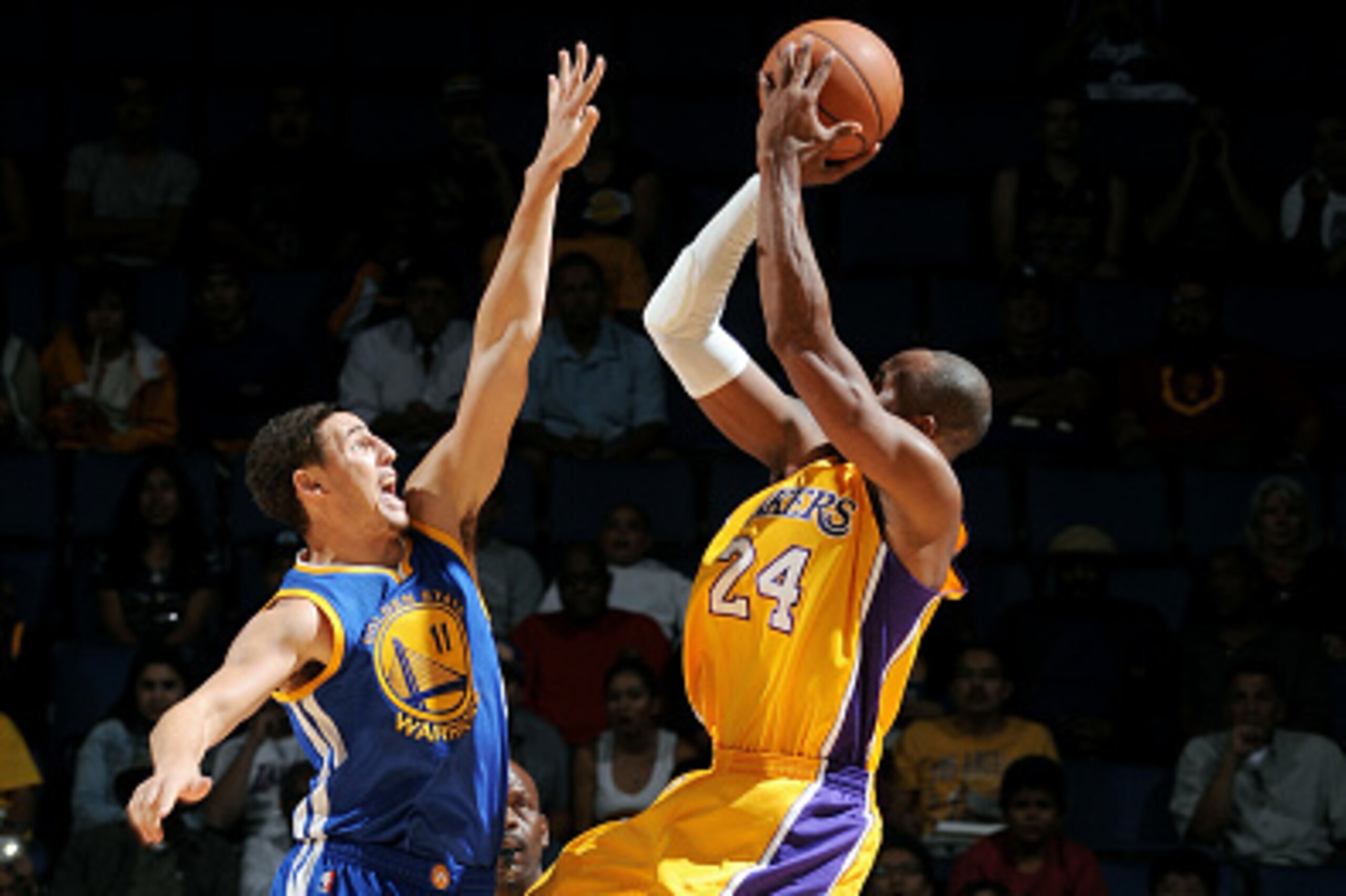 ONTARIO, CA - OCTOBER 12:  Kobe Bryant #24 of the Los Angeles Lakers shoots the ball against Klay Thompson #11 of the Golden State Warriors on October 12, 2014 at Citizens Business Bank Arena in Ontario, California. NOTE TO USER: User expressly acknowledg