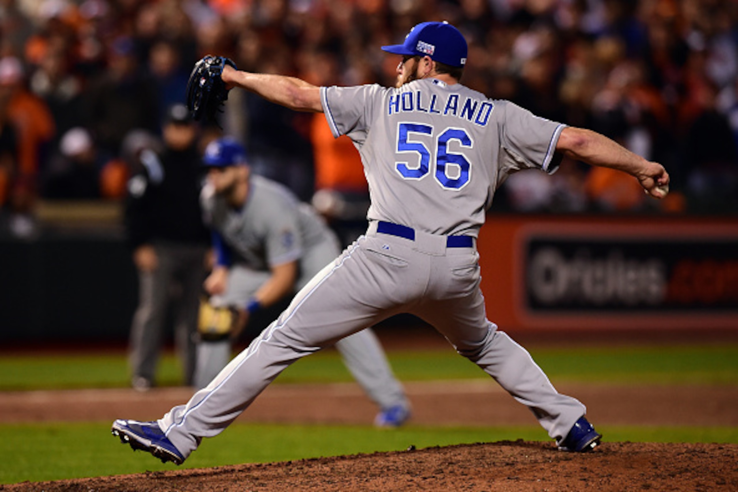 BALTIMORE, MD - OCTOBER 11:  Greg Holland #56 of the Kansas City Royals throws a pitch in the ninth inning against the Baltimore Orioles during Game Two of the American League Championship Series at Oriole Park at Camden Yards on October 11, 2014 in Balti