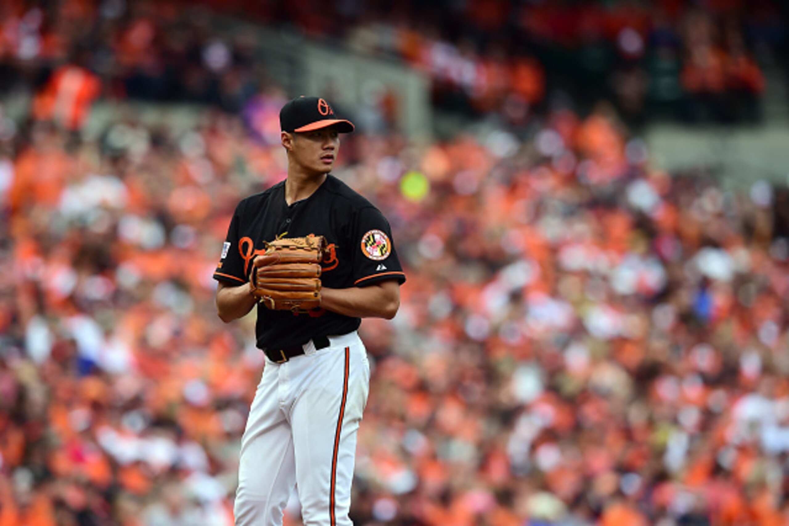 BALTIMORE, MD - OCTOBER 03:  Wei-Yin Chen #16 of the Baltimore Orioles looks on against the Detroit Tigers during Game Two of the American League Division Series at Oriole Park at Camden Yards on October 3, 2014 in Baltimore, Maryland.  (Photo by Patrick 