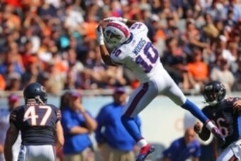 Sep 7, 2014; Chicago, IL, USA; Buffalo Bills wide receiver Robert Woods (10) makes a catch with Chicago Bears free safety Chris Conte (47) defending during the second half at Soldier Field. Buffalo won 23-20 in overtime. Mandatory Credit: Dennis Wierzbick