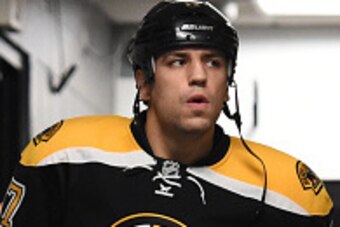 BOSTON, MA - OCTOBER 8: Milan Lucic #17 of the Boston Bruins walks to the ice for warm ups against the Philadelphia Flyers before the season opener at the TD Garden on October 8, 2014 in Boston, Massachusetts.  (Photo by Brian Babineau/NHLI via Getty Imag