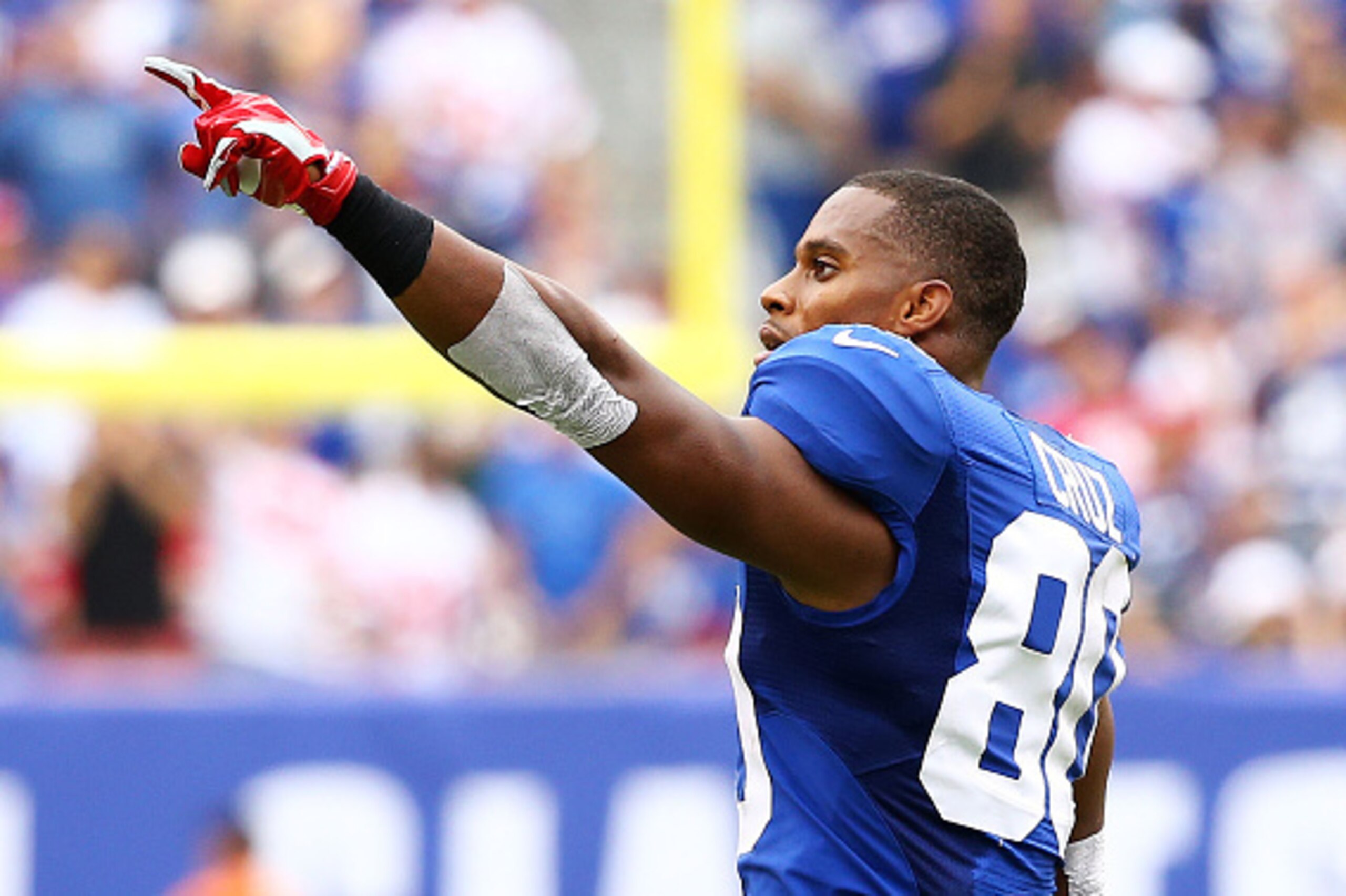 EAST RUTHERFORD, NJ - SEPTEMBER 21:  Victor Cruz #80 of the New York Giants celebrates against the Houston Texans at MetLife Stadium on September 21, 2014 in East Rutherford, New Jersey.  (Photo by Al Bello/Getty Images)