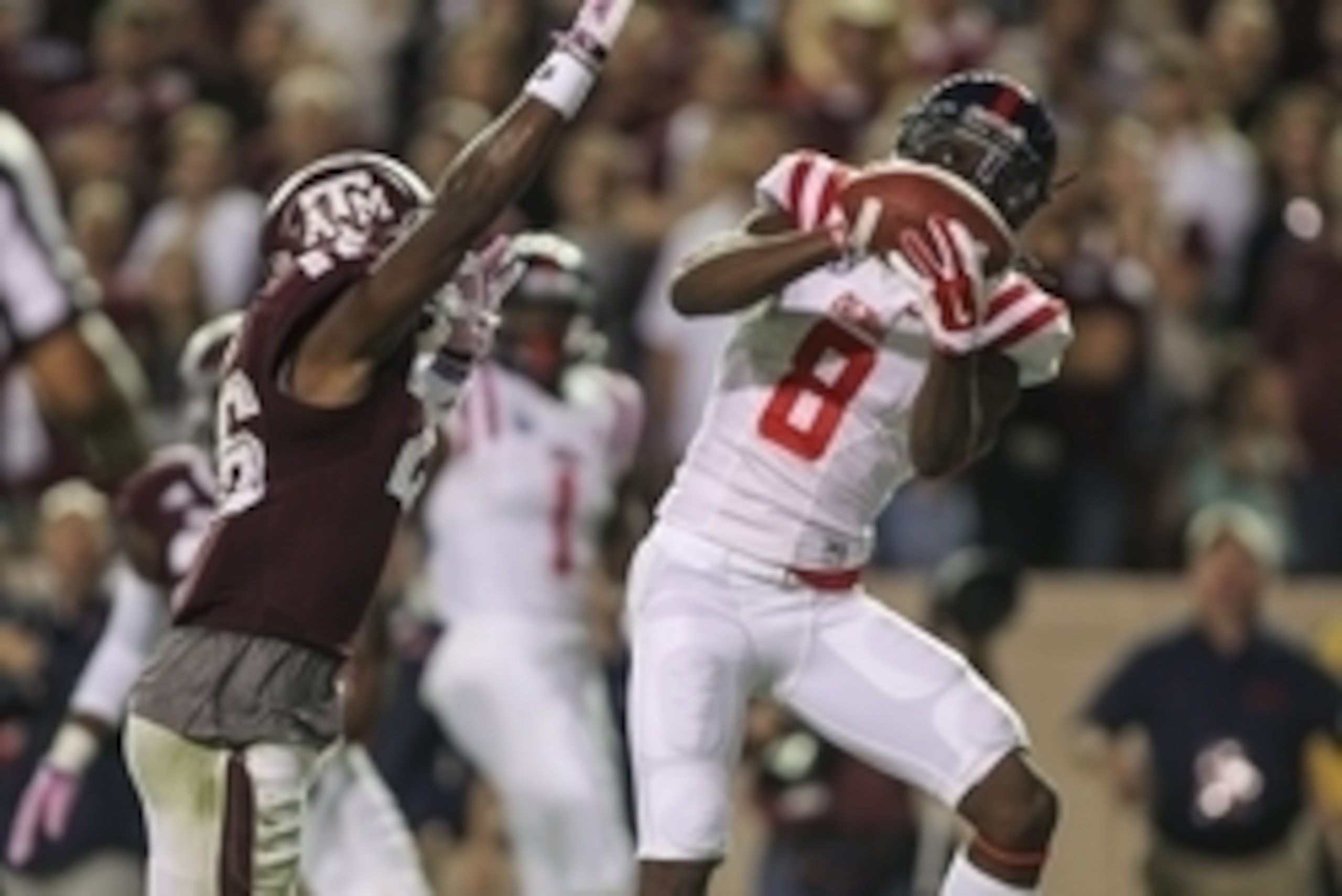 Oct 11, 2014; College Station, TX, USA; Mississippi Rebels wide receiver Quincy Adeboyejo (8) catches a pass for a touchdown during the third quarter as Texas A&M Aggies defensive back Devonta Burns (26) defends at Kyle Field. Mandatory Credit: Troy Taorm