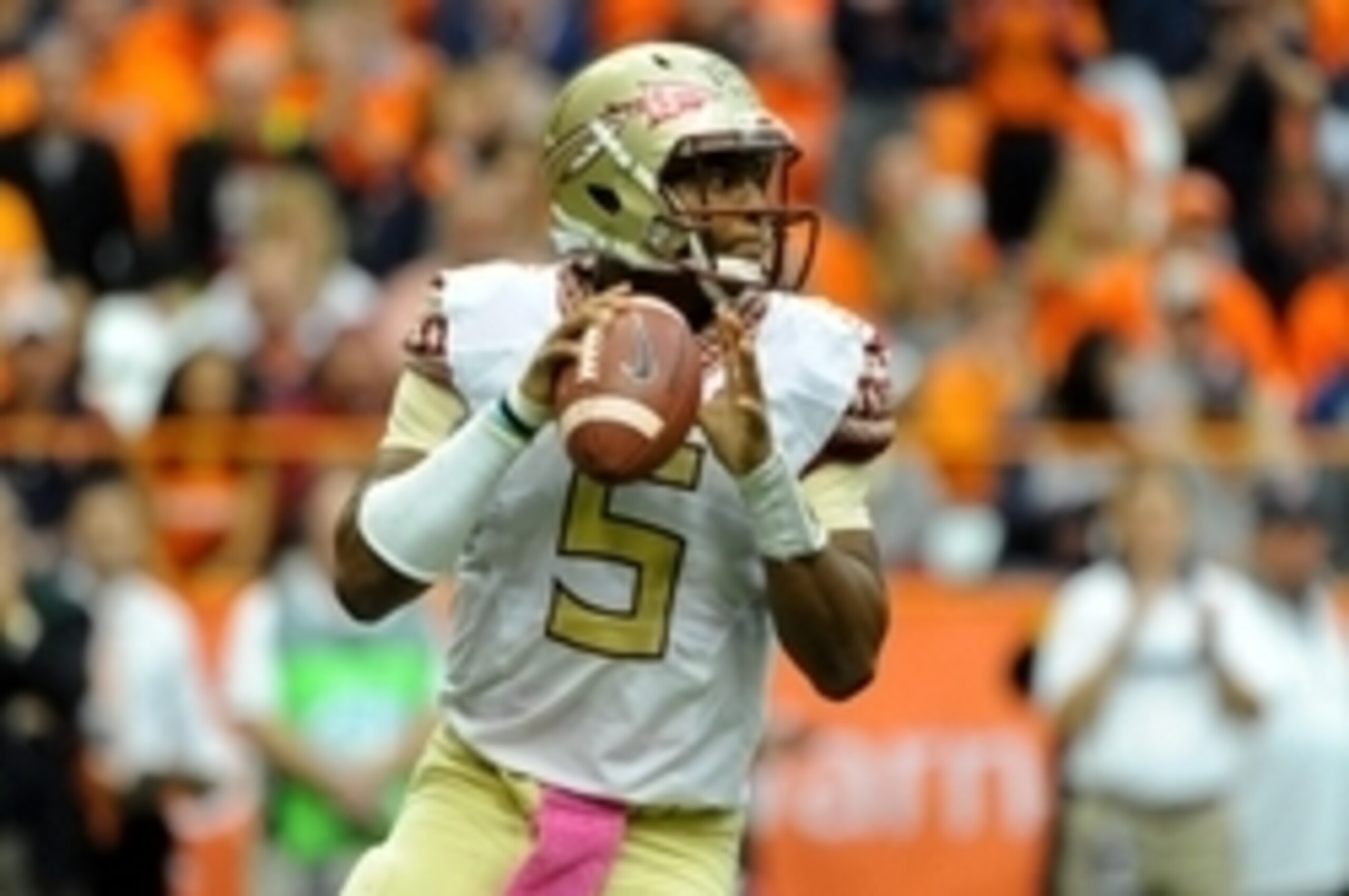 Oct 11, 2014; Syracuse, NY, USA; Florida State Seminoles quarterback Jameis Winston (5) drops back to pass against the Syracuse Orange during the second quarter at the Carrier Dome.  Florida State defeated Syracuse 38-20.  Mandatory Credit: Rich Barnes-US