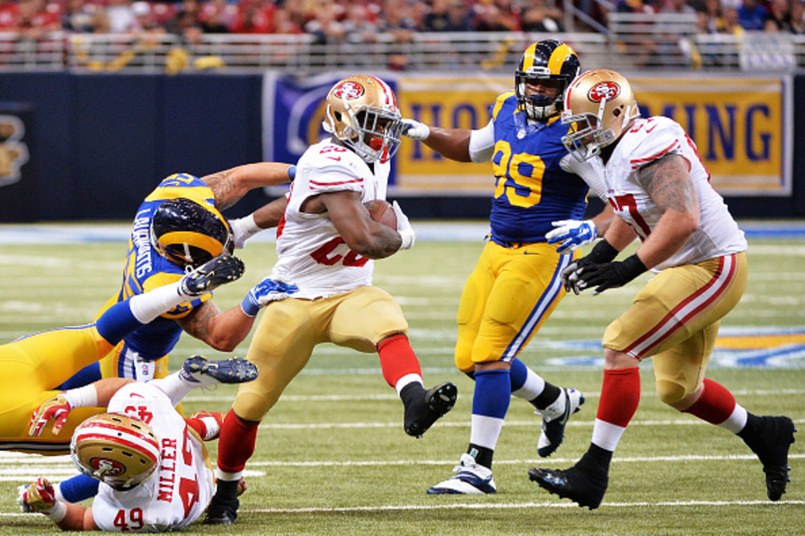 ST LOUIS, MO - OCTOBER 13:  Carlos Hyde #28 of the San Francisco 49ers carries the ball against the St. Louis Rams in the fourth quarter at Edward Jones Dome on October 13, 2014 in St Louis, Missouri.  (Photo by Michael Thomas/Getty Images)
