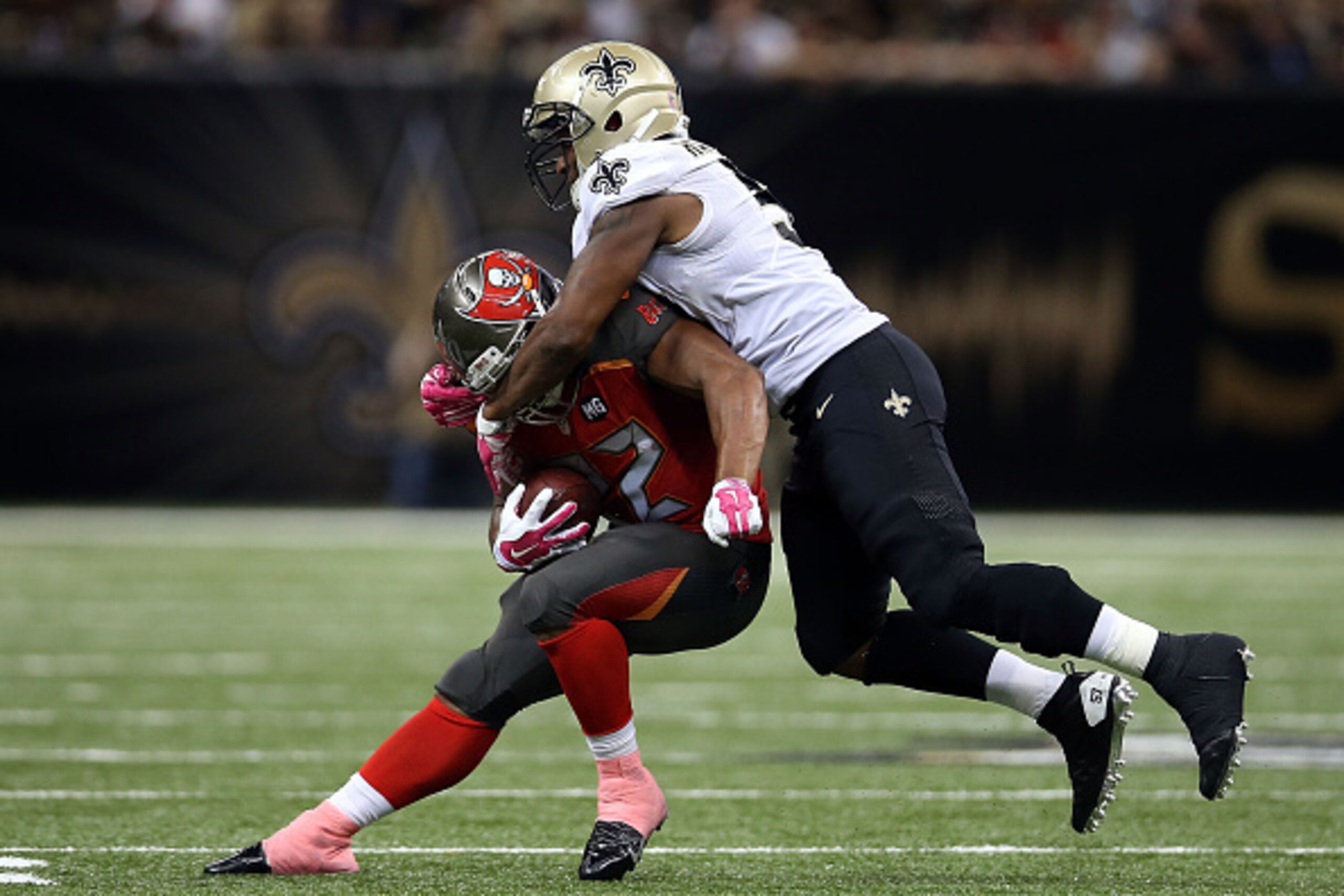 NEW ORLEANS, LA - OCTOBER 05: Doug Martin #22 of the Tampa Bay Buccaneers is brought down by Ramon Humber #53 of the New Orleans Saints during the third quarter of a game at the Mercedes-Benz Superdome on October 5, 2014 in New Orleans, Louisiana. (Phot NEW ORLEANS, LA - OCTOBER 05: Doug Martin #22 of the Tampa Bay Buccaneers is brought down by Ramon Humber #53 of the New Orleans Saints during the third quarter of a game at the Mercedes-Benz Superdome on October 5, 2014 in New Orleans, Louisiana. (Phot