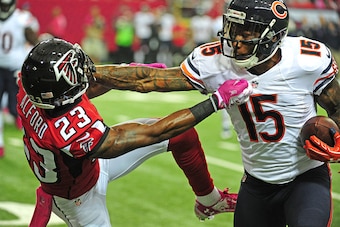 ATLANTA, GA - OCTOBER 12:  Brandon Marshall #15 of the Chicago Bears shakes off the tackle attempt by Robert Alford #23 of the Atlanta Falcons at the Georgia Dome on October 12, 2014 in Atlanta, Georgia. (Photo by Scott Cunningham/Getty Images)