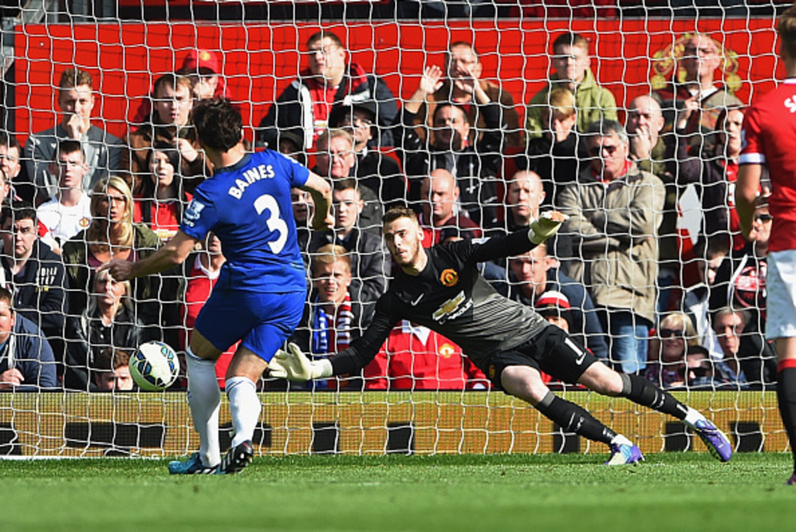 MANCHESTER, ENGLAND - OCTOBER 05:  Leighton Baines of Everton takes and has a penalty kick saved by David De Gea of Manchester United during the Barclays Premier League match between Manchester United and Everton at Old Trafford on October 5, 2014 in Manc