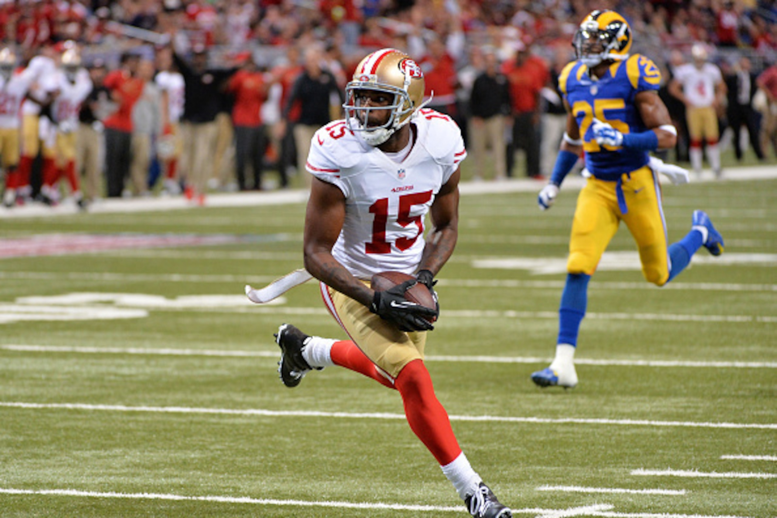 ST LOUIS, MO - OCTOBER 13: Michael Crabtree #15 of the San Francisco 49ers carries a pass completion into the endzone for a 32 yard touchdown in the third quarter against the St. Louis Rams at Edward Jones Dome on October 13, 2014 in St Louis, Missouri. ST LOUIS, MO - OCTOBER 13: Michael Crabtree #15 of the San Francisco 49ers carries a pass completion into the endzone for a 32 yard touchdown in the third quarter against the St. Louis Rams at Edward Jones Dome on October 13, 2014 in St Louis, Missouri.