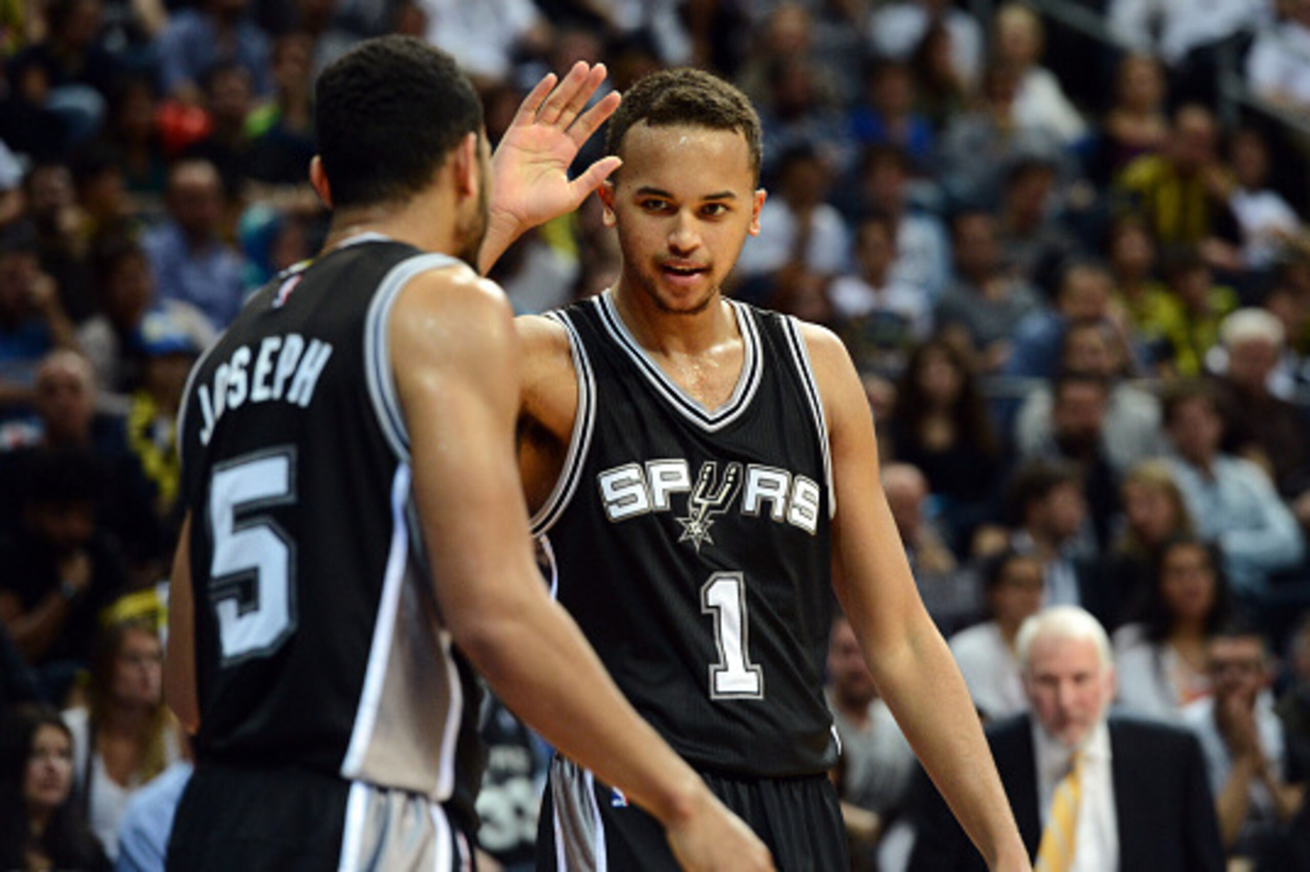 ISTANBUL, TURKEY - OCTOBER 11: Kyle Anderson #1 and Cory Joseph #5 of the San Antonio Spurs high five each other against Fenerbahce Ulker during a game as part of the NBA Global Games on October 11, 2014 at the Ulker Sports Arena in Istanbul, Turkey. NOTE