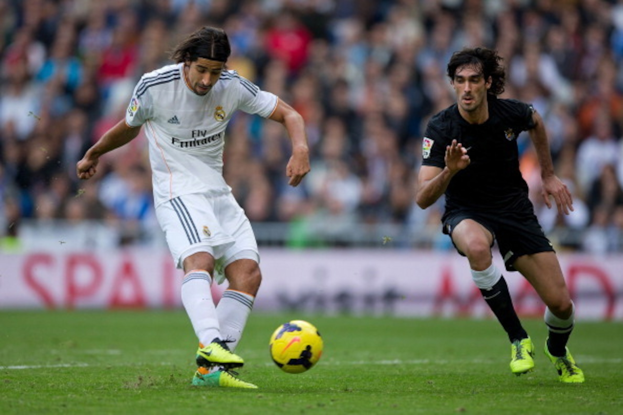 MADRID, SPAIN - NOVEMBER 09: Sami Khedira of Real Madrid CF scores their fourth goal against Carlos Martinez of Real Sociedad during the La Liga match between Real Madrid CF and Real Sociedad de Futbol at Estadio Santiago Bernabeu on November 9, 2013 in MADRID, SPAIN - NOVEMBER 09: Sami Khedira of Real Madrid CF scores their fourth goal against Carlos Martinez of Real Sociedad during the La Liga match between Real Madrid CF and Real Sociedad de Futbol at Estadio Santiago Bernabeu on November 9, 2013 in