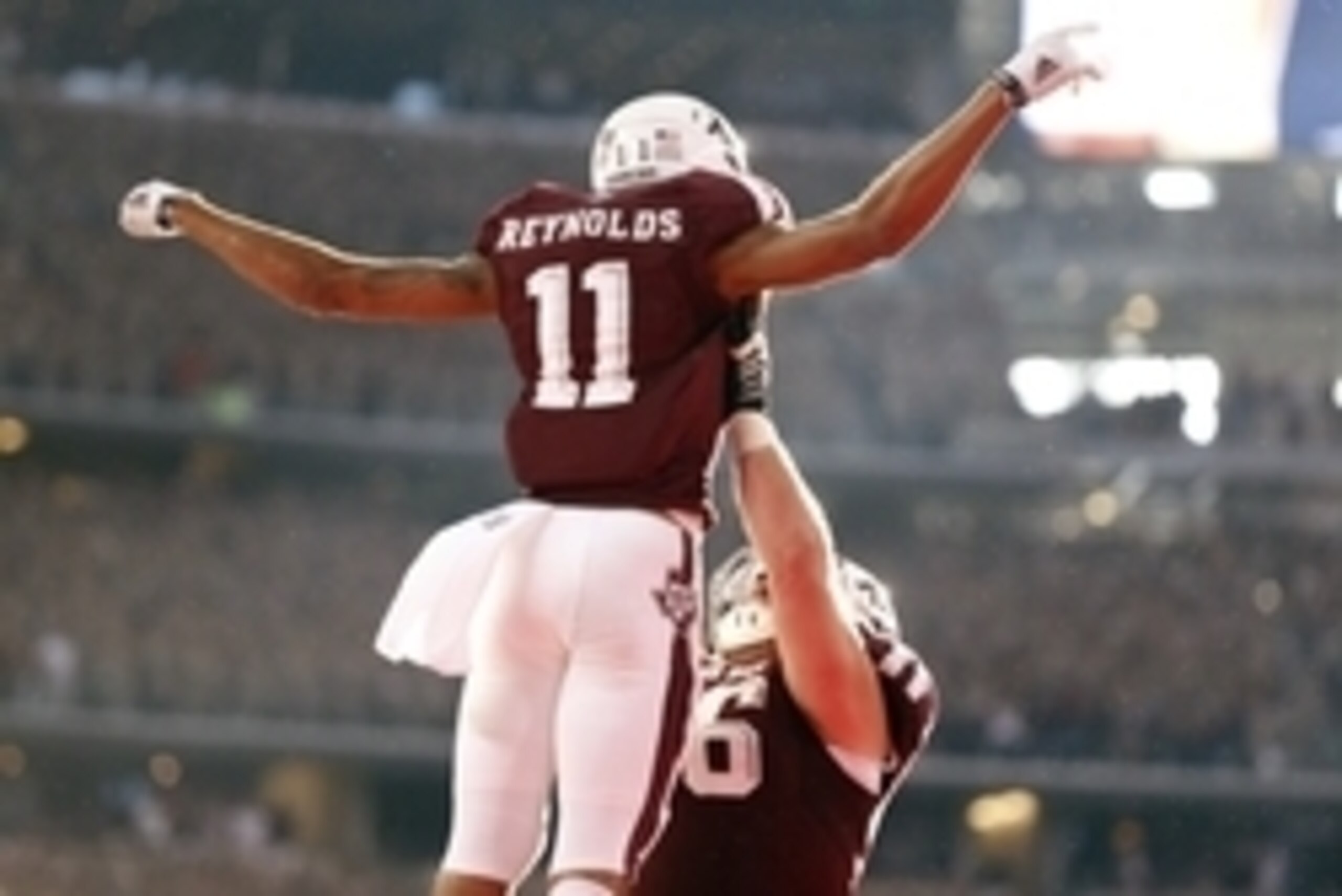 Sep 27, 2014; Arlington, TX, USA; Texas A&M Aggies receiver Josh Reynolds (11) celebrates after scoring the game tying touchdown in the fourth quarter against the Arkansas Razorbacks at AT&T Stadium. The Aggies beat the Razorbacks 35-28.  Mandatory Credit