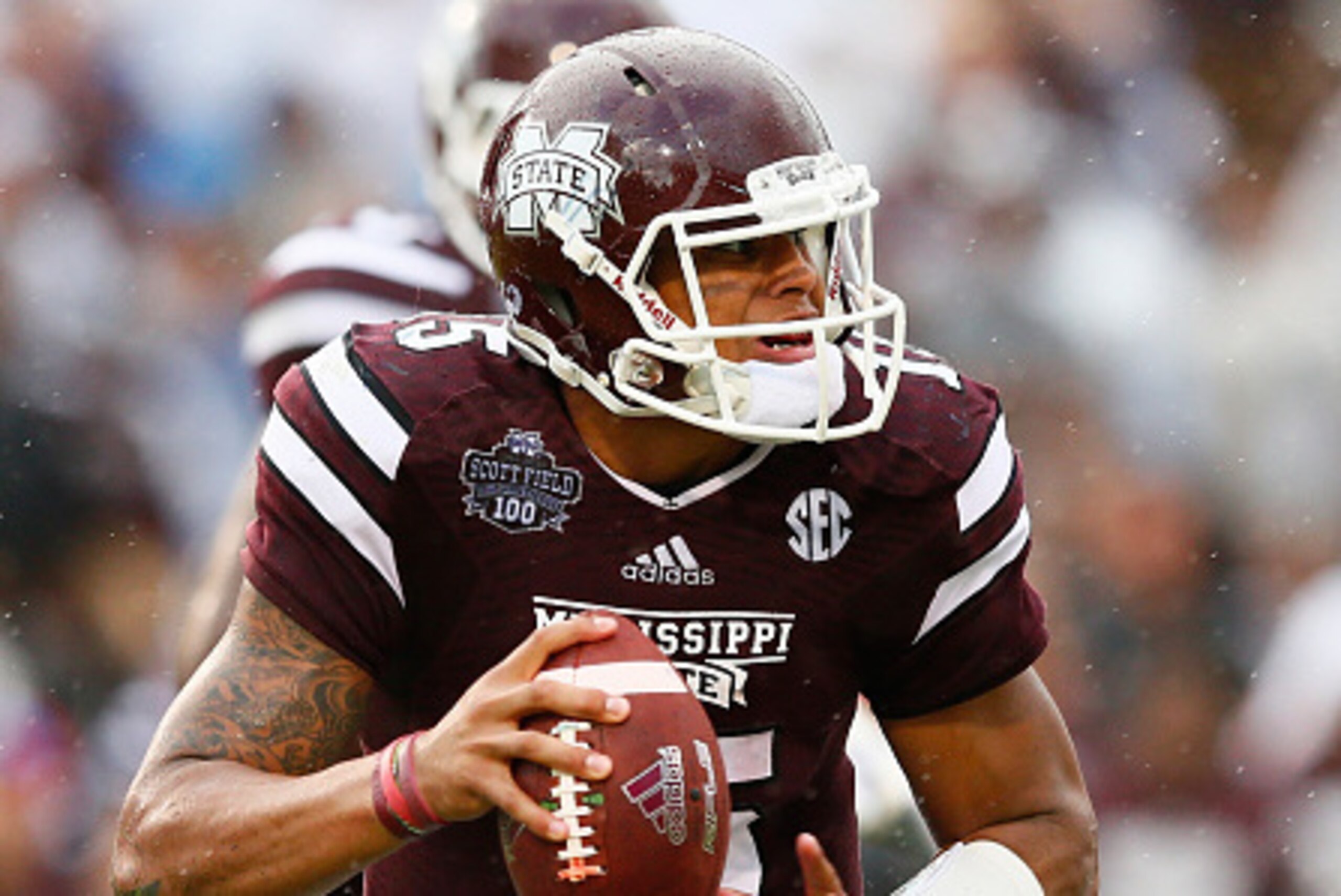 STARKVILLE, MS - OCTOBER 11:  Angelo Blackson #98 of the Auburn Tigers sacks Dak Prescott #15 of the Mississippi State Bulldogs at Davis Wade Stadium on October 11, 2014 in Starkville, Mississippi.  (Photo by Kevin C. Cox/Getty Images)