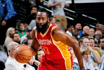 DALLAS, TX - OCTOBER 7: James Harden #13 of the Houston Rockets handles the ball against the Dallas Mavericks on October 7, 2014 at the American Airlines Center in Dallas, Texas. NOTE TO USER: User expressly acknowledges and agrees that, by downloading an
