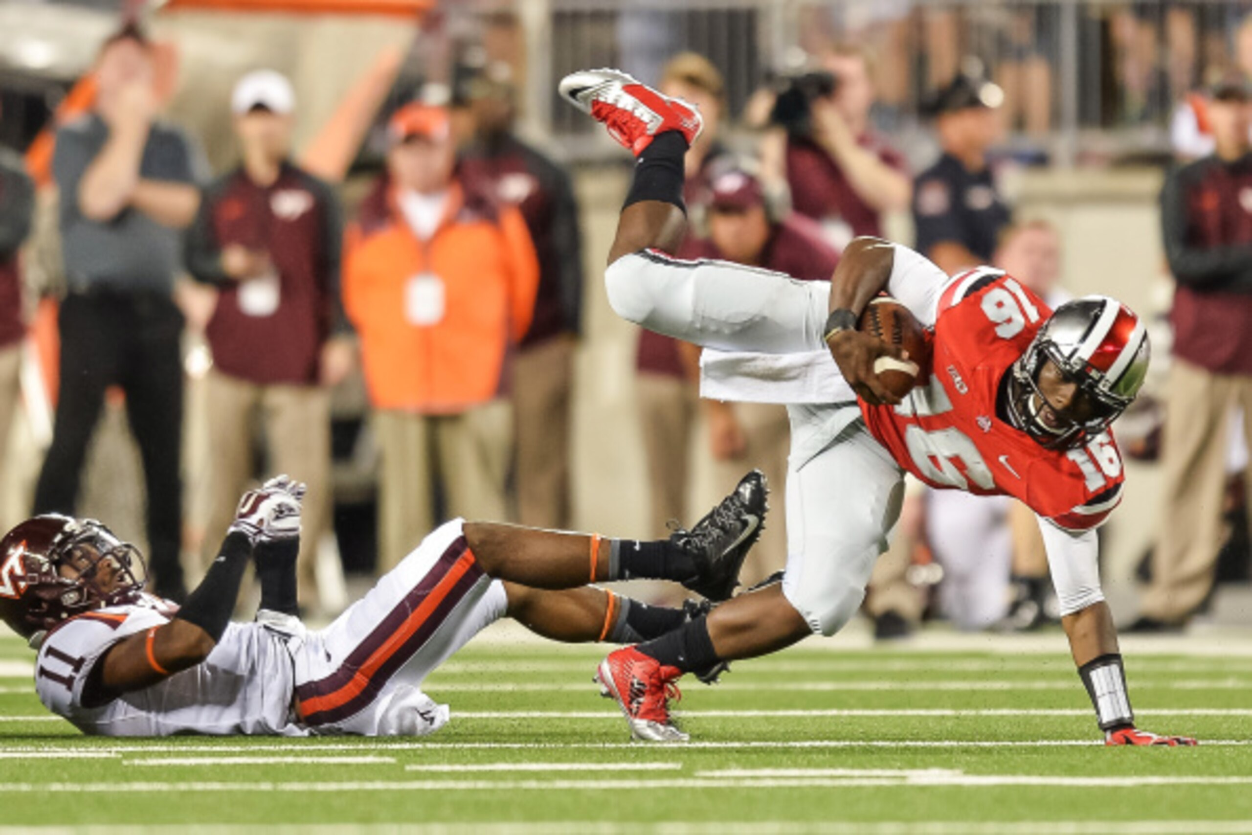 COLUMBUS, OH - SEPTEMBER 6:  Quarterback J.T. Barrett #16 of the Ohio State Buckeyes runs with the ball against the Virginia Tech Hokies at Ohio Stadium on September 6, 2014 in Columbus, Ohio.  (Photo by Jamie Sabau/Getty Images)