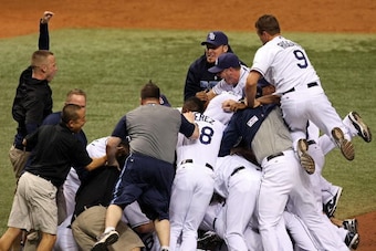 ST PETERSBURG, FL - OCTOBER 19:  The Tampa Bay Rays celebrate after defeating  the Boston Red Sox in game seven of the American League Championship Series during the 2008 MLB playoffs on October 19, 2008 at Tropicana Field in St Petersburg, Florida.  (Pho