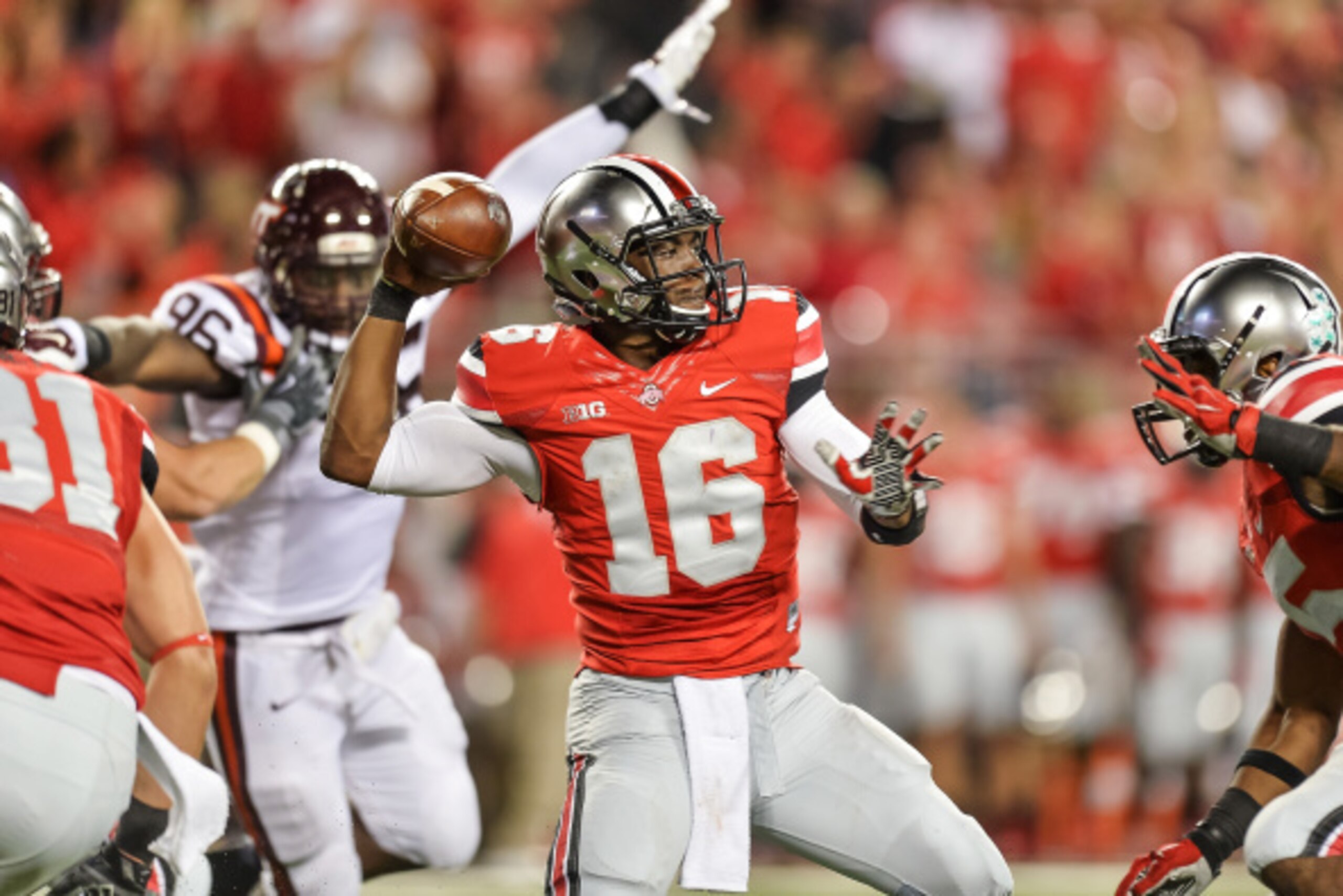 COLUMBUS, OH - SEPTEMBER 6:  Quarterback J.T. Barrett #16 of the Ohio State Buckeyes passes against the Virginia Tech Hokies at Ohio Stadium on September 6, 2014 in Columbus, Ohio.  (Photo by Jamie Sabau/Getty Images)