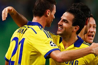 LISBON, PORTUGAL - SEPTEMBER 30:  Nemanja Matic of Chelsea (21) celebrates with team mate Cesc Fabregas as he scores their first goal  during the UEFA Champions League Group G match between Sporting Clube de Portugal and Chelsea FC at Estadio Jose Alvalad