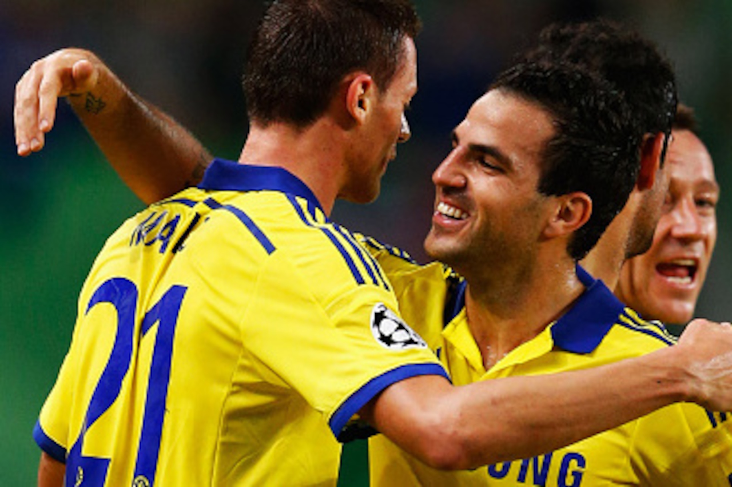 LISBON, PORTUGAL - SEPTEMBER 30:  Nemanja Matic of Chelsea (21) celebrates with team mate Cesc Fabregas as he scores their first goal  during the UEFA Champions League Group G match between Sporting Clube de Portugal and Chelsea FC at Estadio Jose Alvalad
