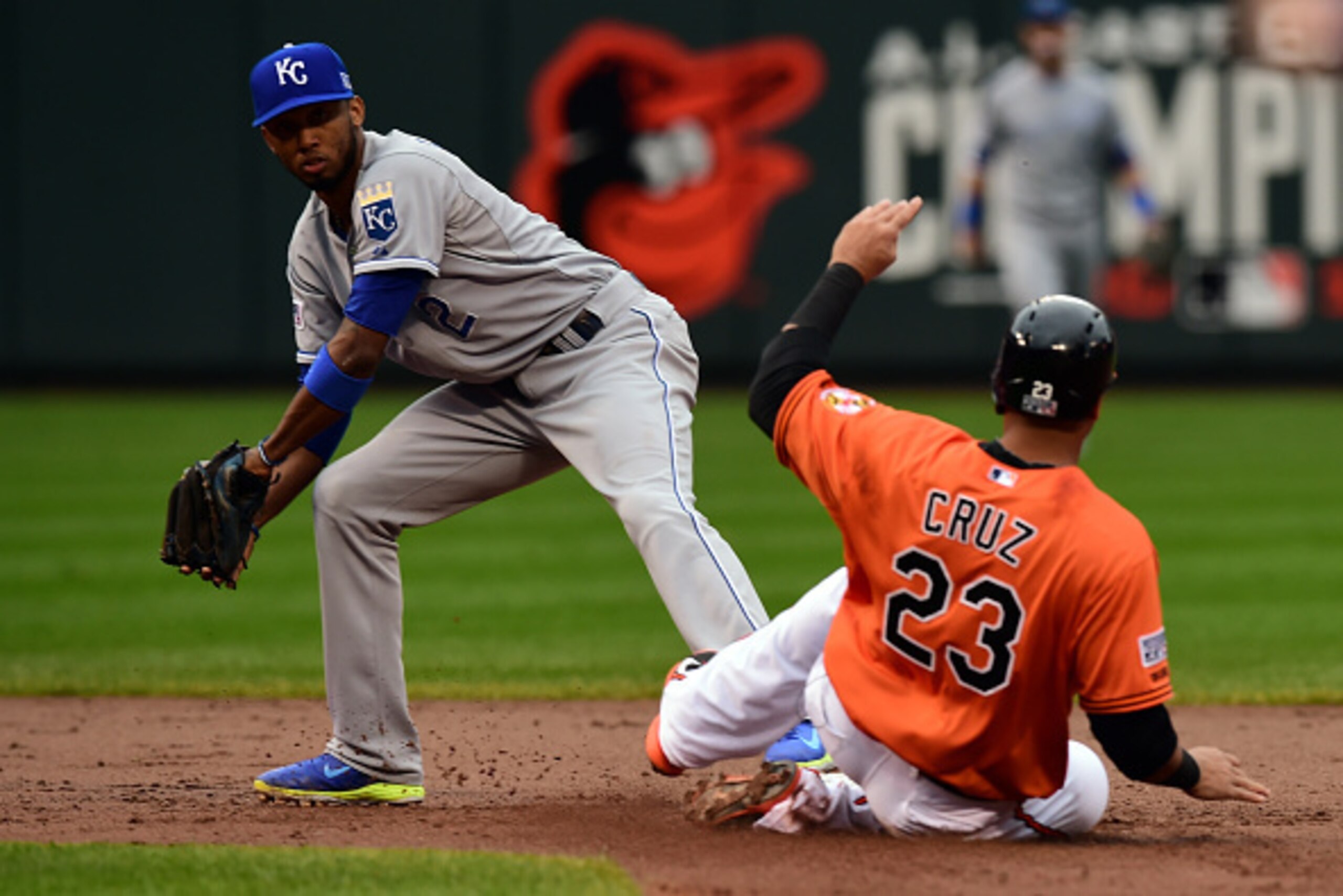 BALTIMORE, MD - OCTOBER 11:  Nelson Cruz #23 of the Baltimore Orioles gets tagged out by Alcides Escobar #2 of the Kansas City Royals during Game Two of the American League Championship Series at Oriole Park at Camden Yards on October 11, 2014 in Baltimor