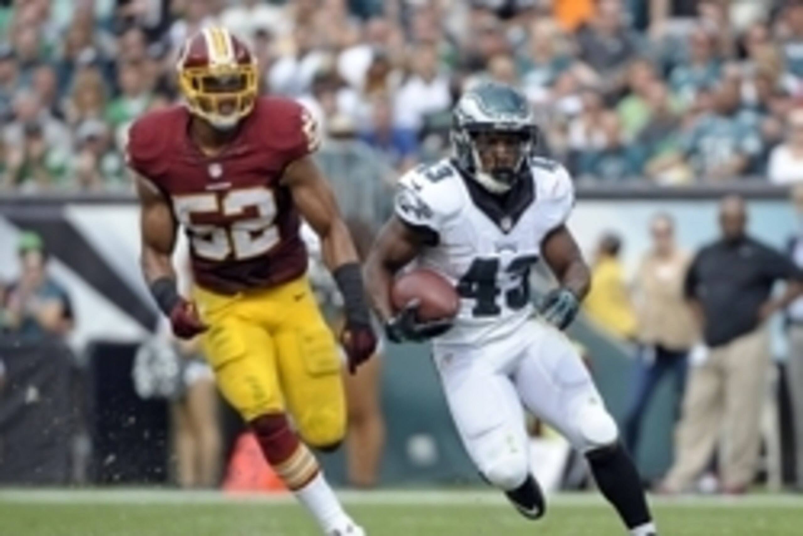 Sep 21, 2014; Philadelphia, PA, USA; Philadelphia Eagles running back Darren Sproles (43) runs past Washington Redskins inside linebacker Keenan Robinson (52) at Lincoln Financial Field. The Eagles defeated the Redskins, 37-34. Mandatory Credit: Eric Hart