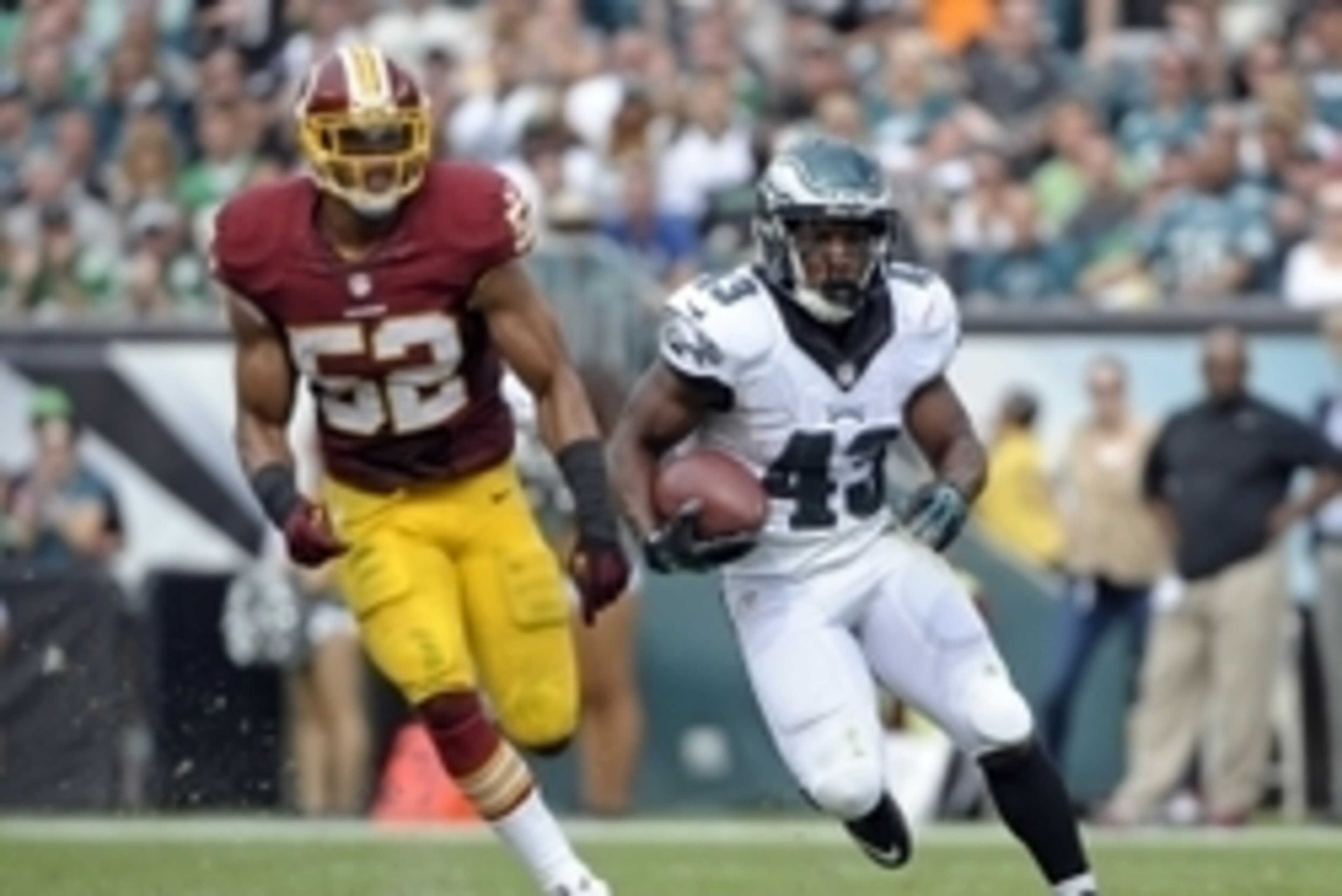 Sep 21, 2014; Philadelphia, PA, USA; Philadelphia Eagles running back Darren Sproles (43) runs past Washington Redskins inside linebacker Keenan Robinson (52) at Lincoln Financial Field. The Eagles defeated the Redskins, 37-34. Mandatory Credit: Eric Hart