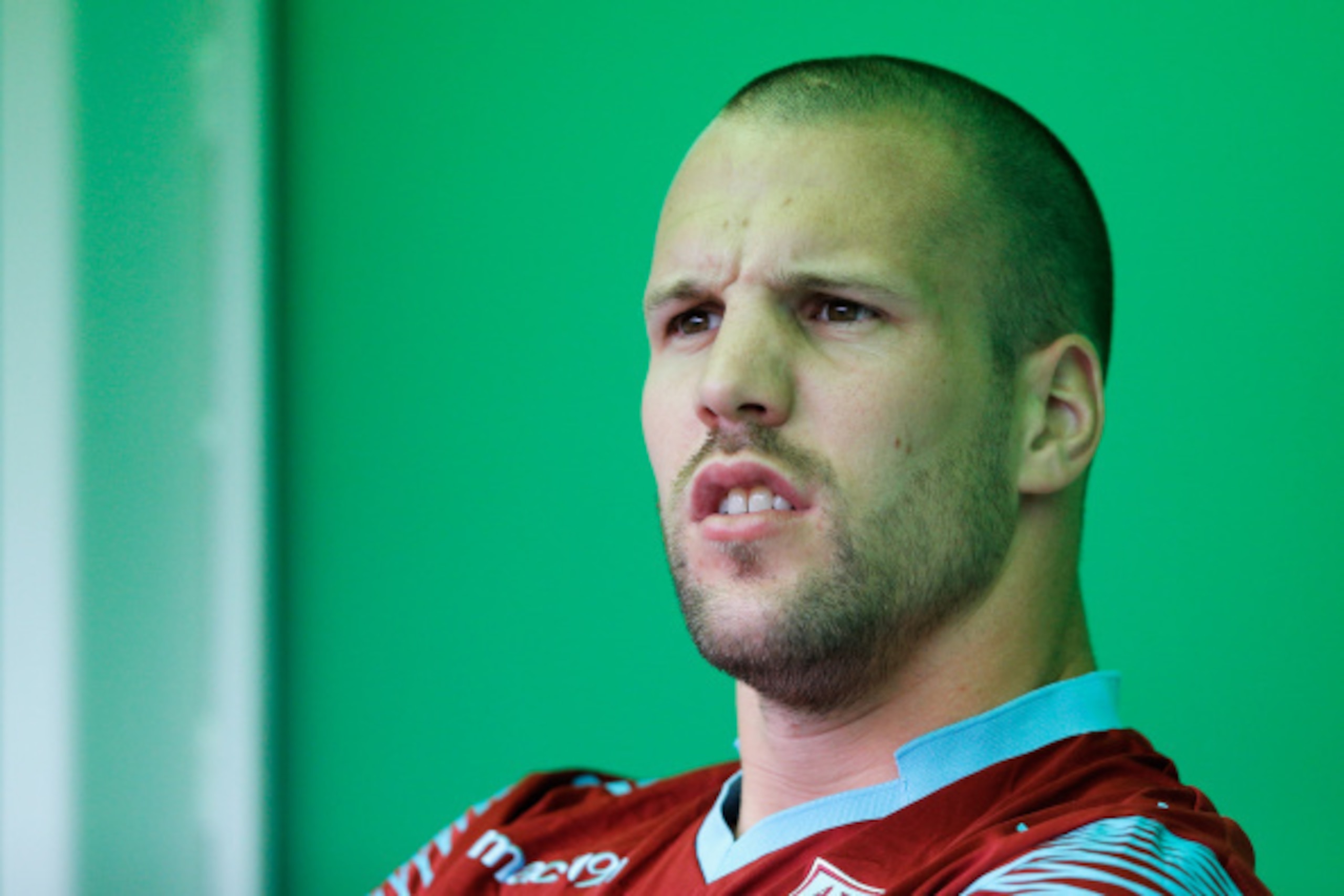 GRONINGEN, NETHERLANDS - AUGUST 02: Ron Vlaar of Aston Villa looks on from the bench during the pre season friendly match between FC Groningen v Aston Villa held at the Euroborg on August 2, 2014 in Groningen, Netherlands. (Photo by Dean Mouhtaropoulos/ GRONINGEN, NETHERLANDS - AUGUST 02: Ron Vlaar of Aston Villa looks on from the bench during the pre season friendly match between FC Groningen v Aston Villa held at the Euroborg on August 2, 2014 in Groningen, Netherlands. (Photo by Dean Mouhtaropoulos/