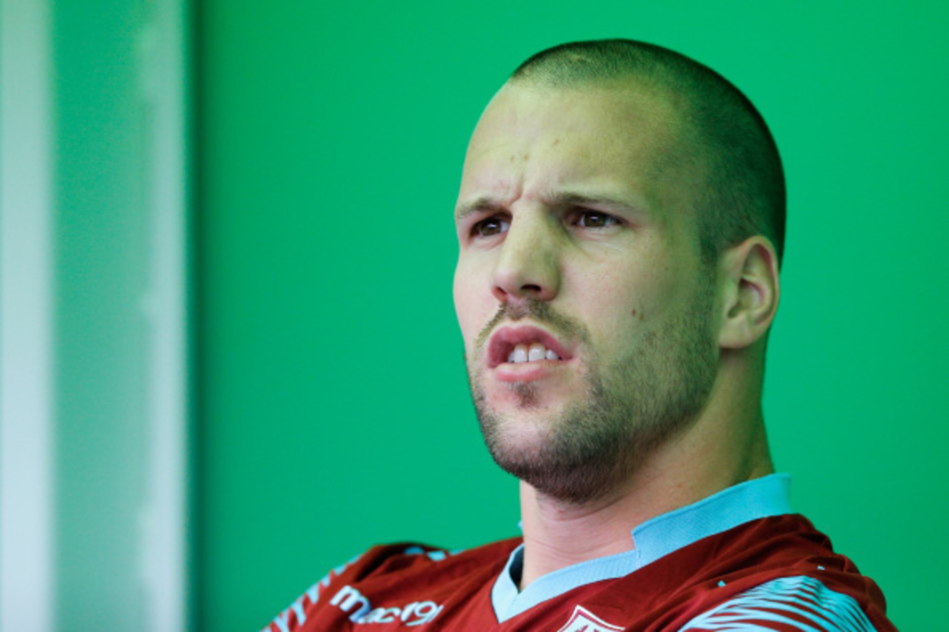 GRONINGEN, NETHERLANDS - AUGUST 02:  Ron Vlaar of Aston Villa looks on from the bench during the pre season friendly match between FC Groningen v Aston Villa held at the Euroborg on August 2, 2014 in Groningen, Netherlands.  (Photo by Dean Mouhtaropoulos/