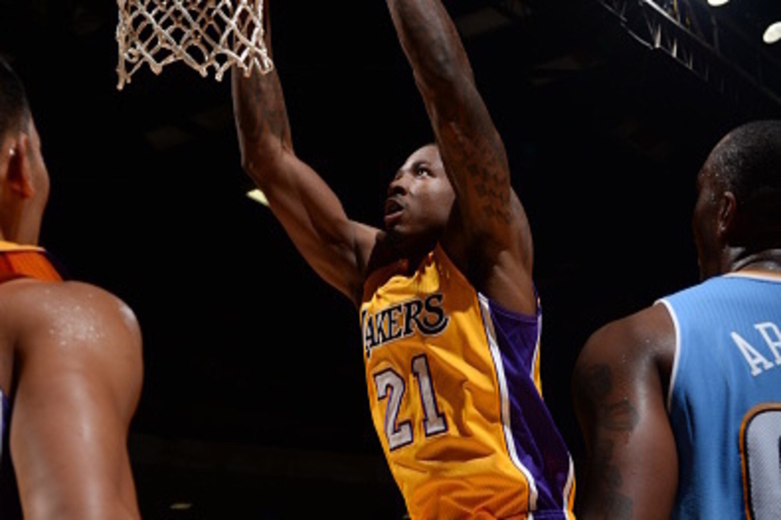 SAN DIEGO, CA- OCTOBER 6: Ed Davis #21 dunks the ball against Darrell Arthur #00 of the Denver Nuggets as the Los Angeles Lakers take on the Denver Nuggets at the Valley View Sports Arena in San Diego, California on October 6, 2014 . NOTE TO USER: User ex SAN DIEGO, CA- OCTOBER 6: Ed Davis #21 dunks the ball against Darrell Arthur #00 of the Denver Nuggets as the Los Angeles Lakers take on the Denver Nuggets at the Valley View Sports Arena in San Diego, California on October 6, 2014 . NOTE TO USER: User ex