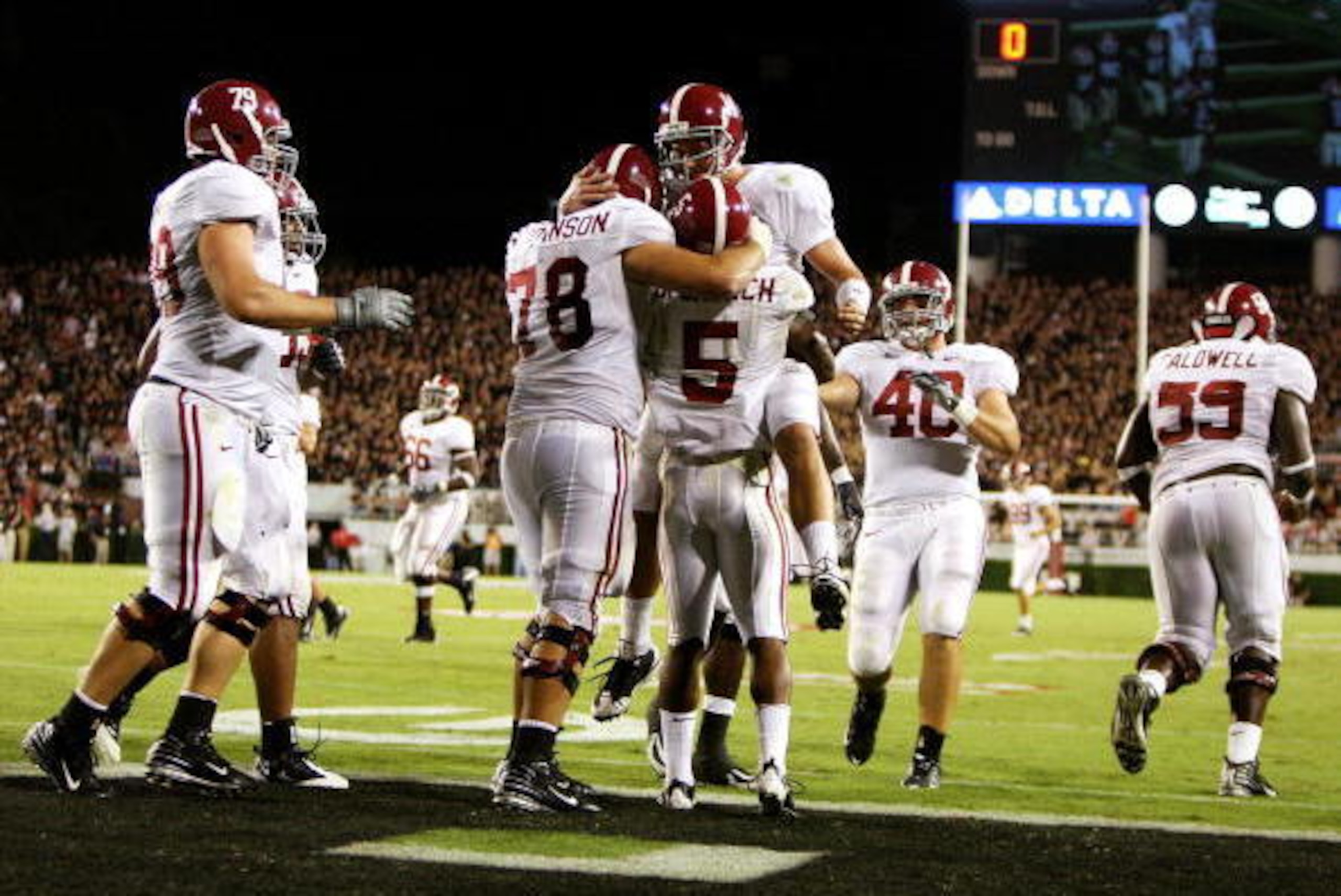 ATHENS, GA - SEPTEMBER 27:  Teammates congratulate running back Roy Upchurch #5 of the Alabama Crimson Tide after his touchdown in the second quarter against the Georgia Bulldogs at Sanford Stadium on September 27, 2008 in Athens, Georgia.  (Photo by Doug