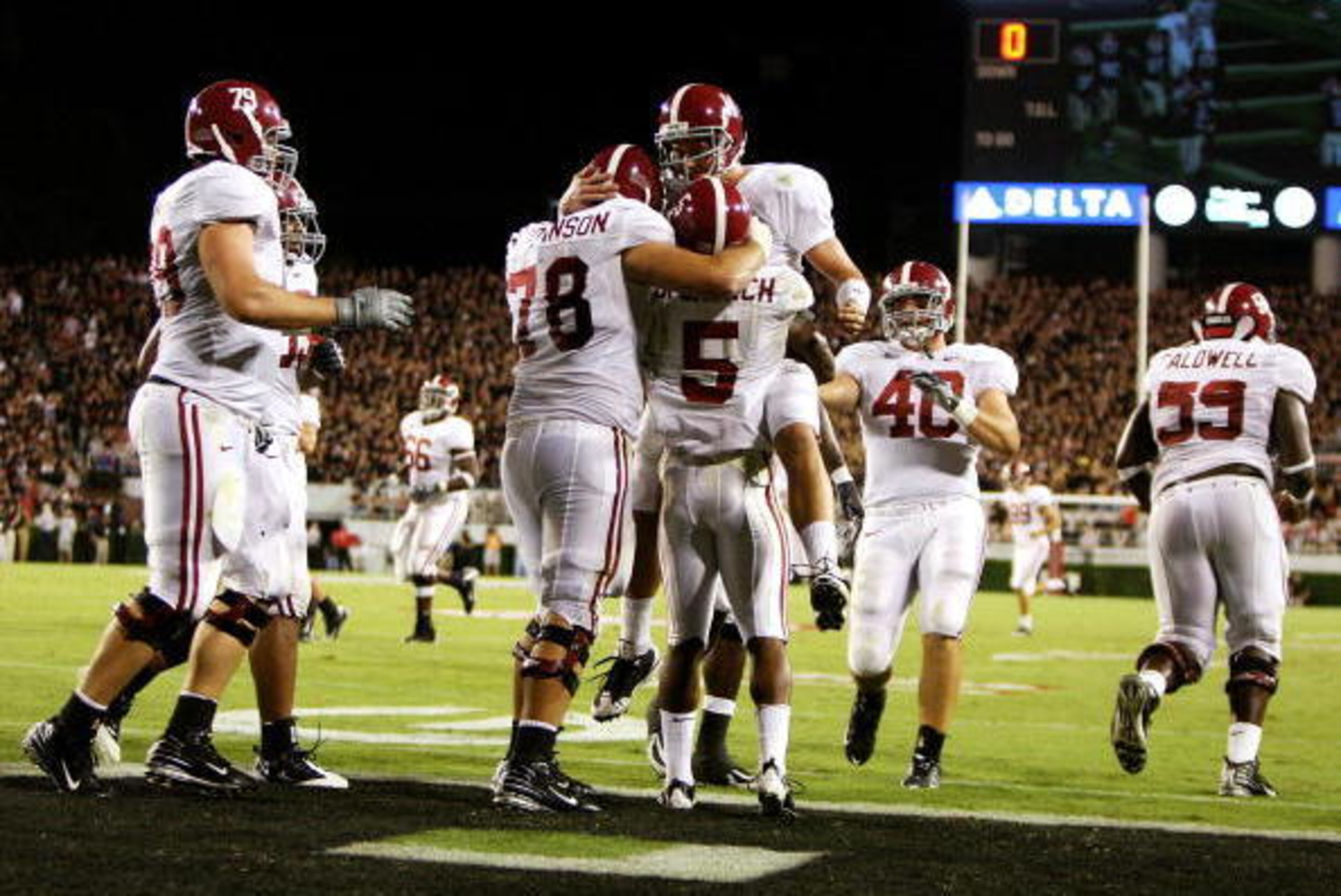 ATHENS, GA - SEPTEMBER 27: Teammates congratulate running back Roy Upchurch #5 of the Alabama Crimson Tide after his touchdown in the second quarter against the Georgia Bulldogs at Sanford Stadium on September 27, 2008 in Athens, Georgia. (Photo by Doug ATHENS, GA - SEPTEMBER 27: Teammates congratulate running back Roy Upchurch #5 of the Alabama Crimson Tide after his touchdown in the second quarter against the Georgia Bulldogs at Sanford Stadium on September 27, 2008 in Athens, Georgia. (Photo by Doug