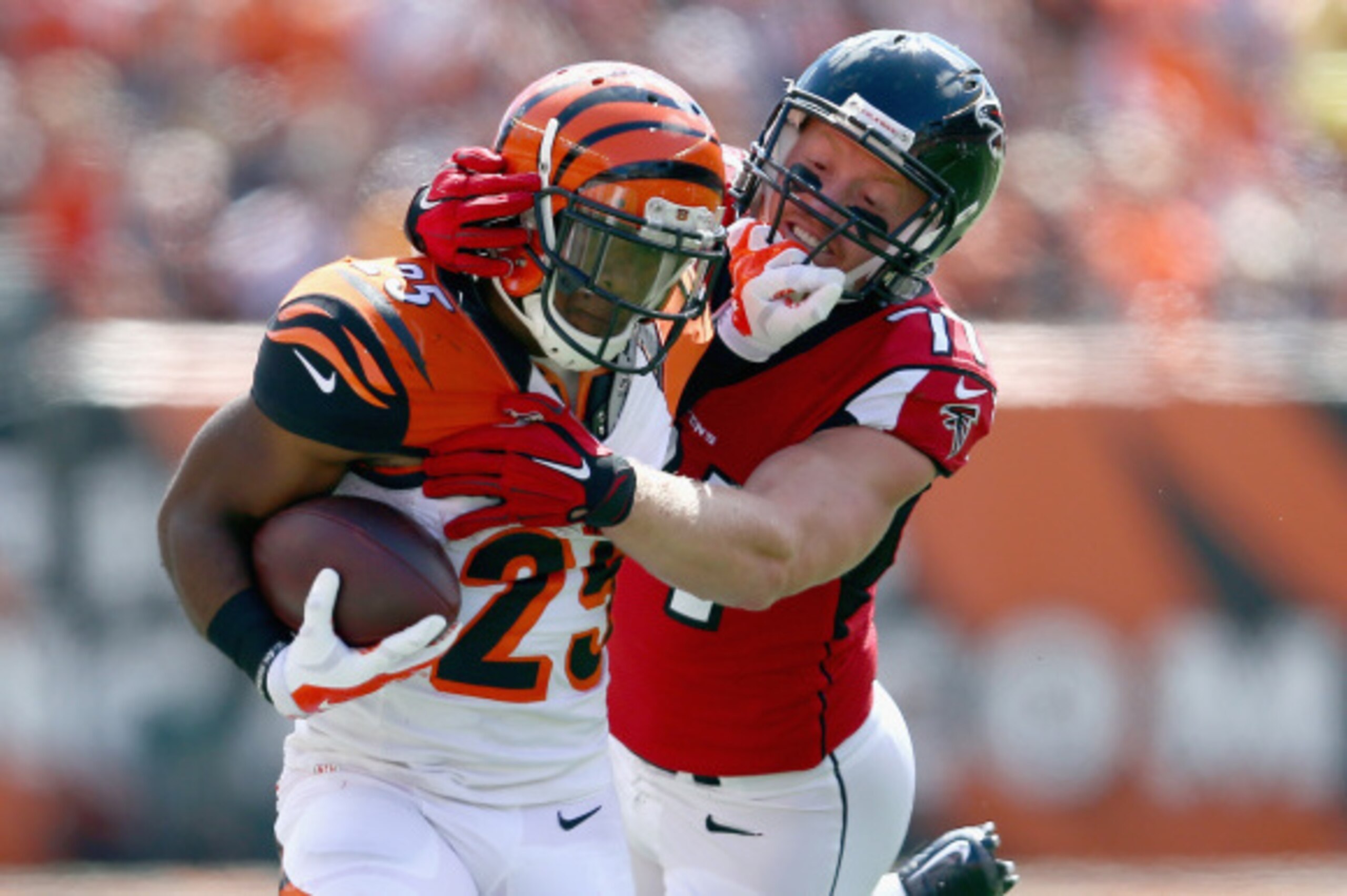 CINCINNATI, OH - SEPTEMBER 14:  Kroy Biermann #71 of the Atlanta Falcons tackles Giovani Bernard #25 of the Cincinnati Bengals during the first quarter at Paul Brown Stadium on September 14, 2014 in Cincinnati, Ohio.  (Photo by Andy Lyons/Getty Images)