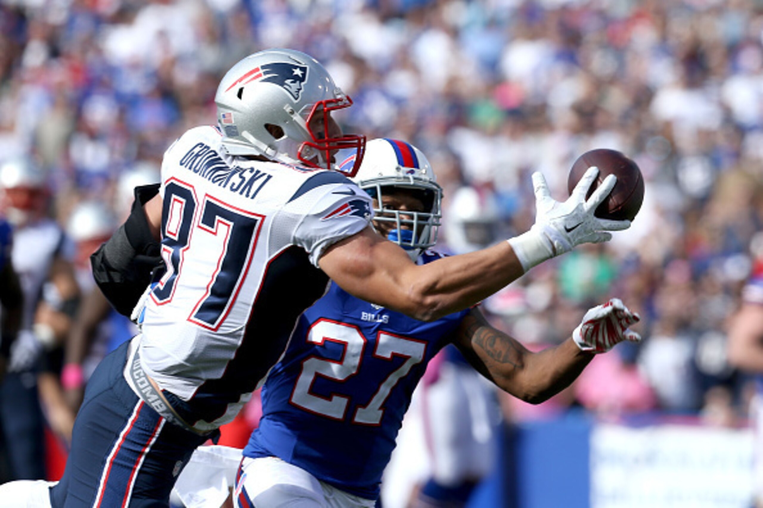ORCHARD PARK, NY - OCTOBER 12: Rob Gronkowski #87 of the New England Patriots makes a catch as Duke Williams #27 of the Buffalo Bills defends during the second half at Ralph Wilson Stadium on October 12, 2014 in Orchard Park, New York. (Photo by Brett ORCHARD PARK, NY - OCTOBER 12: Rob Gronkowski #87 of the New England Patriots makes a catch as Duke Williams #27 of the Buffalo Bills defends during the second half at Ralph Wilson Stadium on October 12, 2014 in Orchard Park, New York. (Photo by Brett