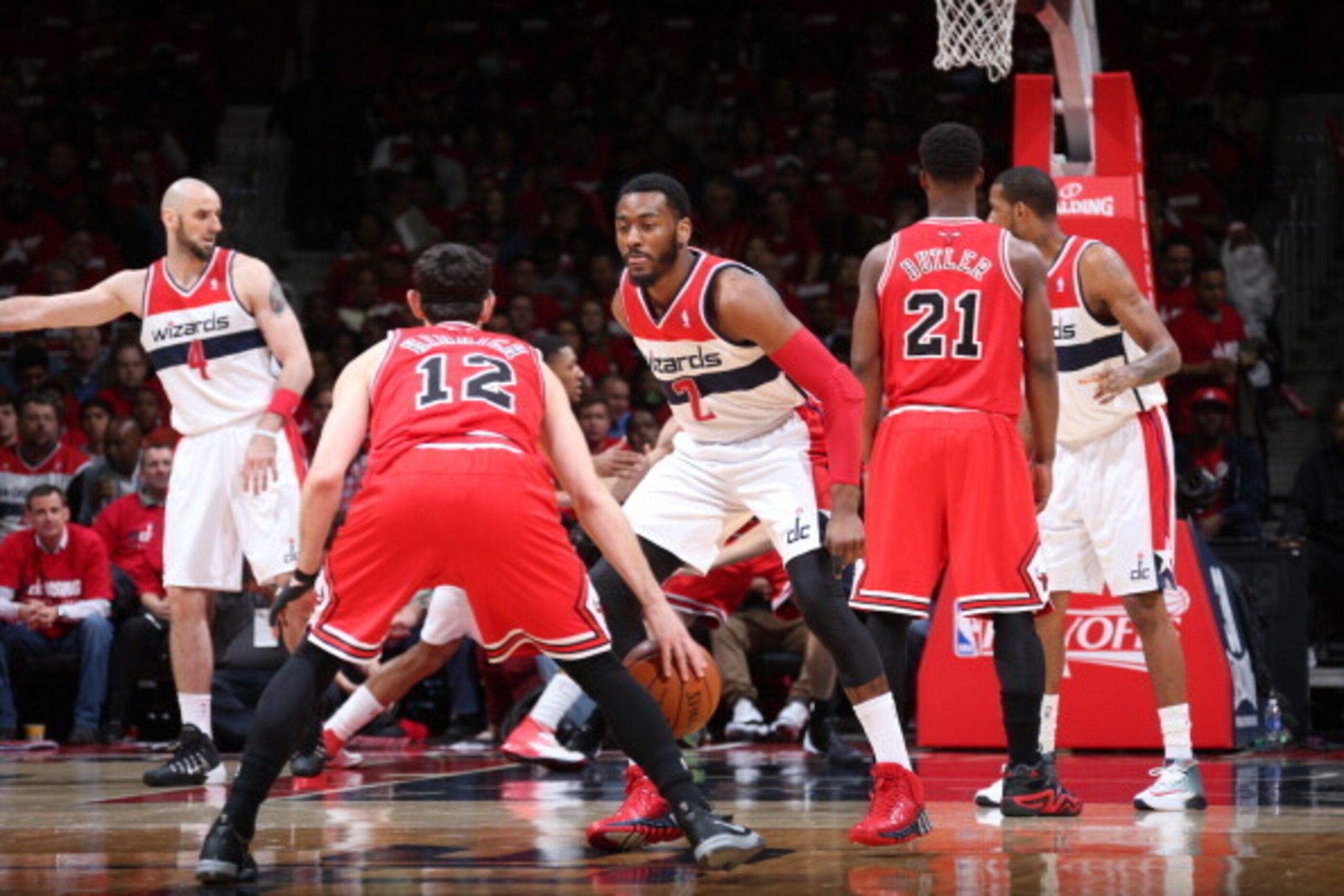 WASHINGTON, DC - APRIL 25: John Wall #1 of the Washington Wizards defends against Kirk Hinrich #12 of the Chicago Bulls in Game Three of the Eastern Conference Quarterfinals during the 2014 NBA Playoffs at the Verizon Center on April 25, 2014 in Washingto