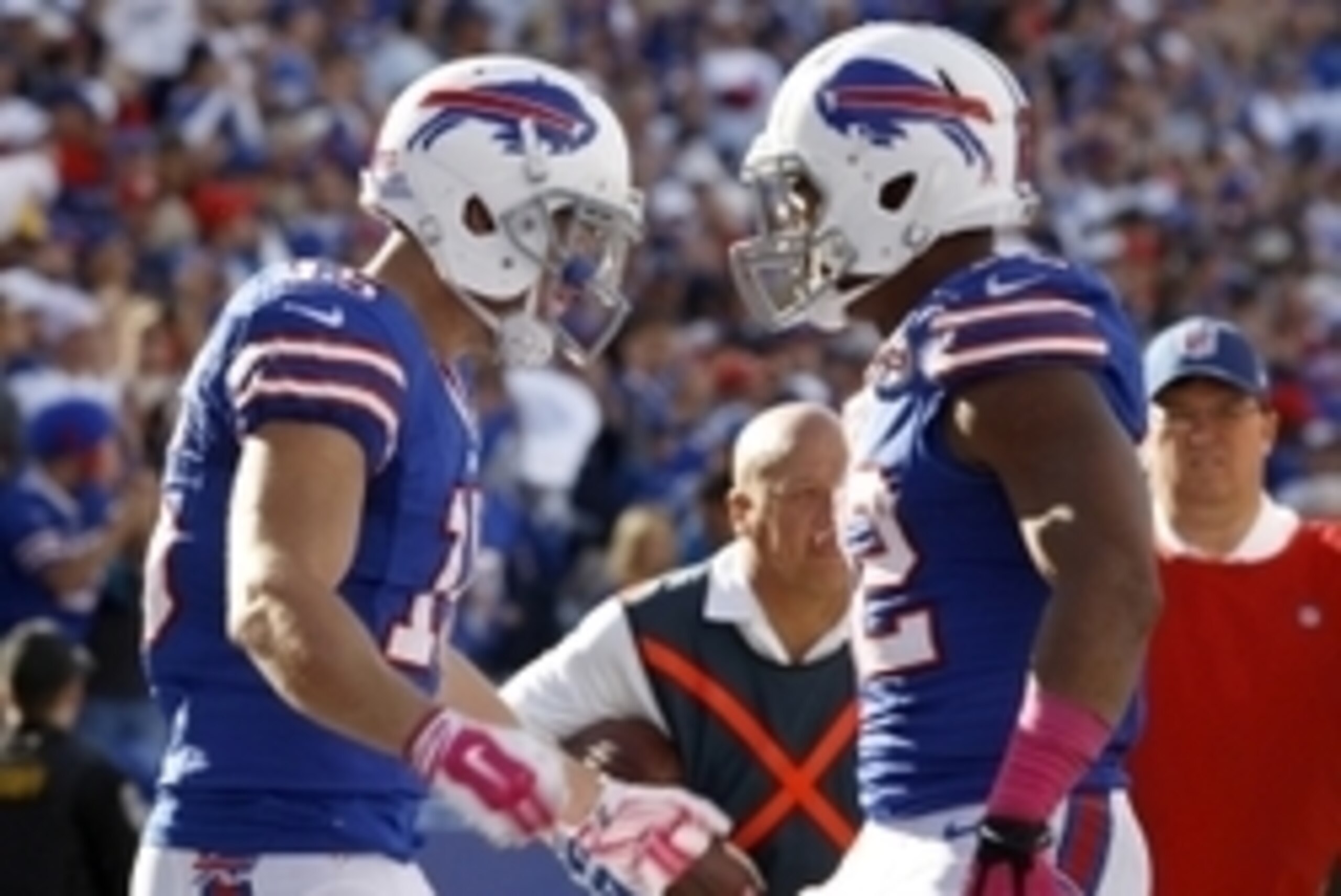 Oct 12, 2014; Orchard Park, NY, USA; Buffalo Bills wide receiver Chris Hogan (15) celebrates his second half touchdown with running back Fred Jackson (22) against the New England Patriots at Ralph Wilson Stadium. New England beats Buffalo 37 to 22.  Manda