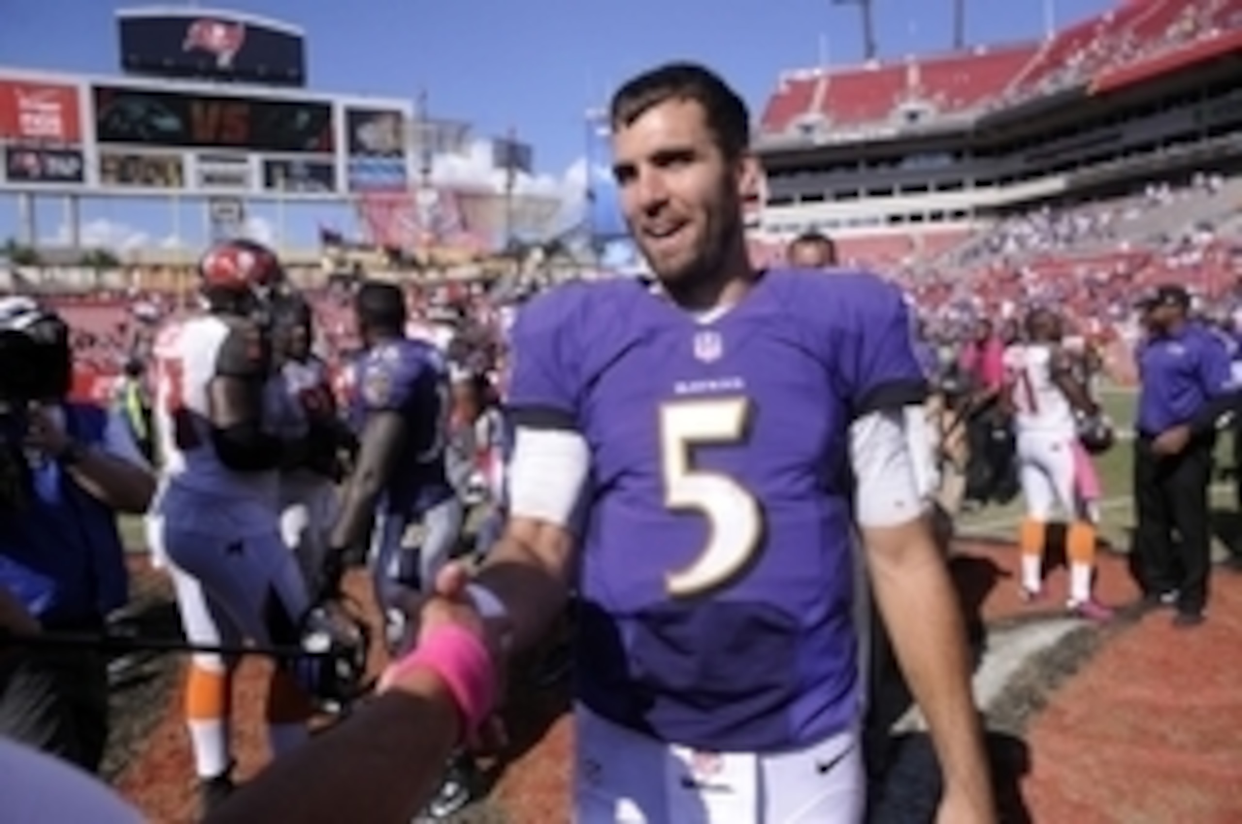 Oct 12, 2014; Tampa, FL, USA; Baltimore Ravens quarterback Joe Flacco (5) celebrates as the Baltimore Ravens beat the Tampa Bay Buccaneers 48-17 at Raymond James Stadium. Mandatory Credit: David Manning-USA TODAY Sports