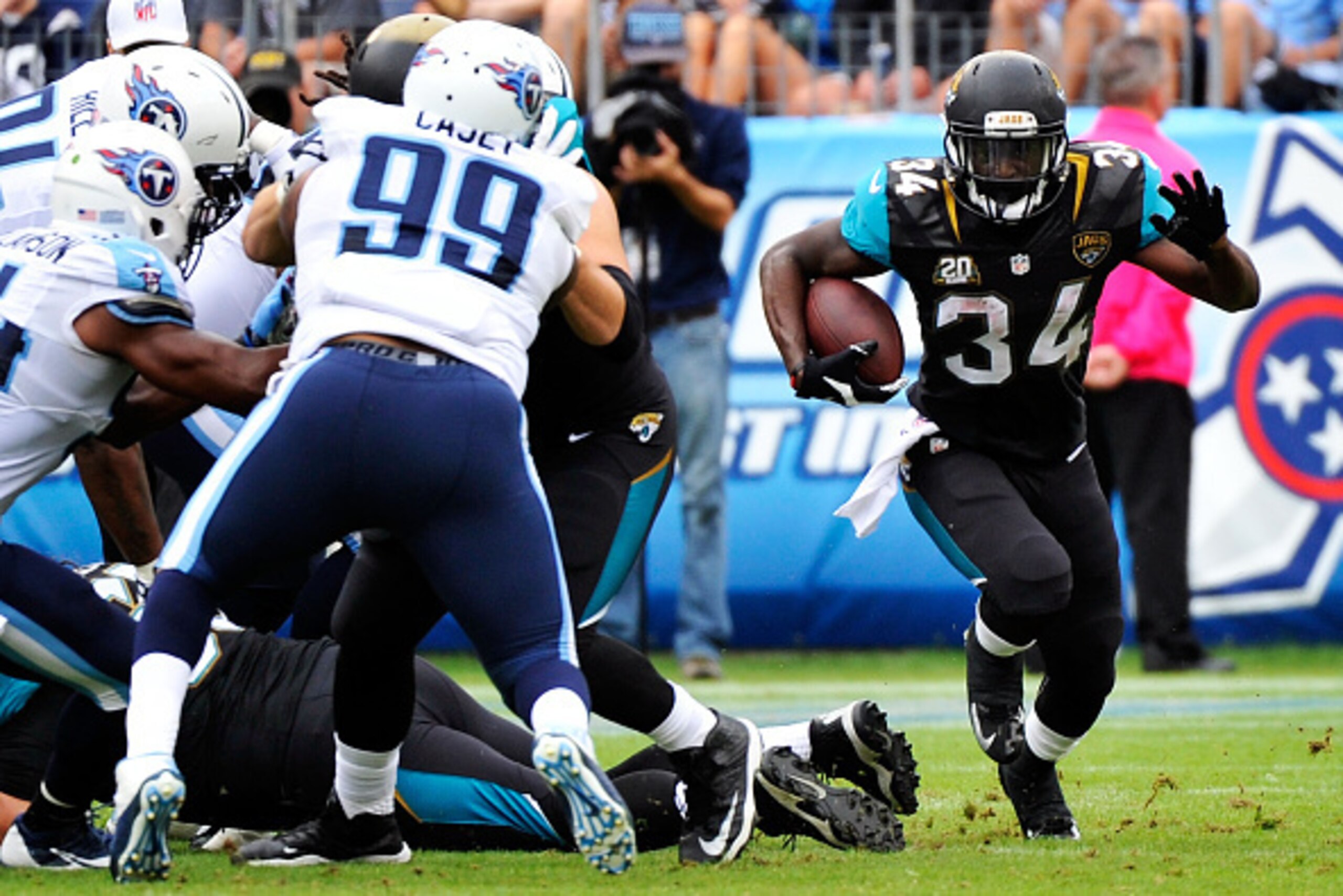 NASHVILLE, TN - OCTOBER 12:  Storm Johnson #34 of the Jacksonville Jaguars runs for yards during the first quarter of a game against the Tennessee Titans at LP Field on October 12, 2014 in Nashville, Tennessee.  (Photo by Frederick Breedon/Getty Images)