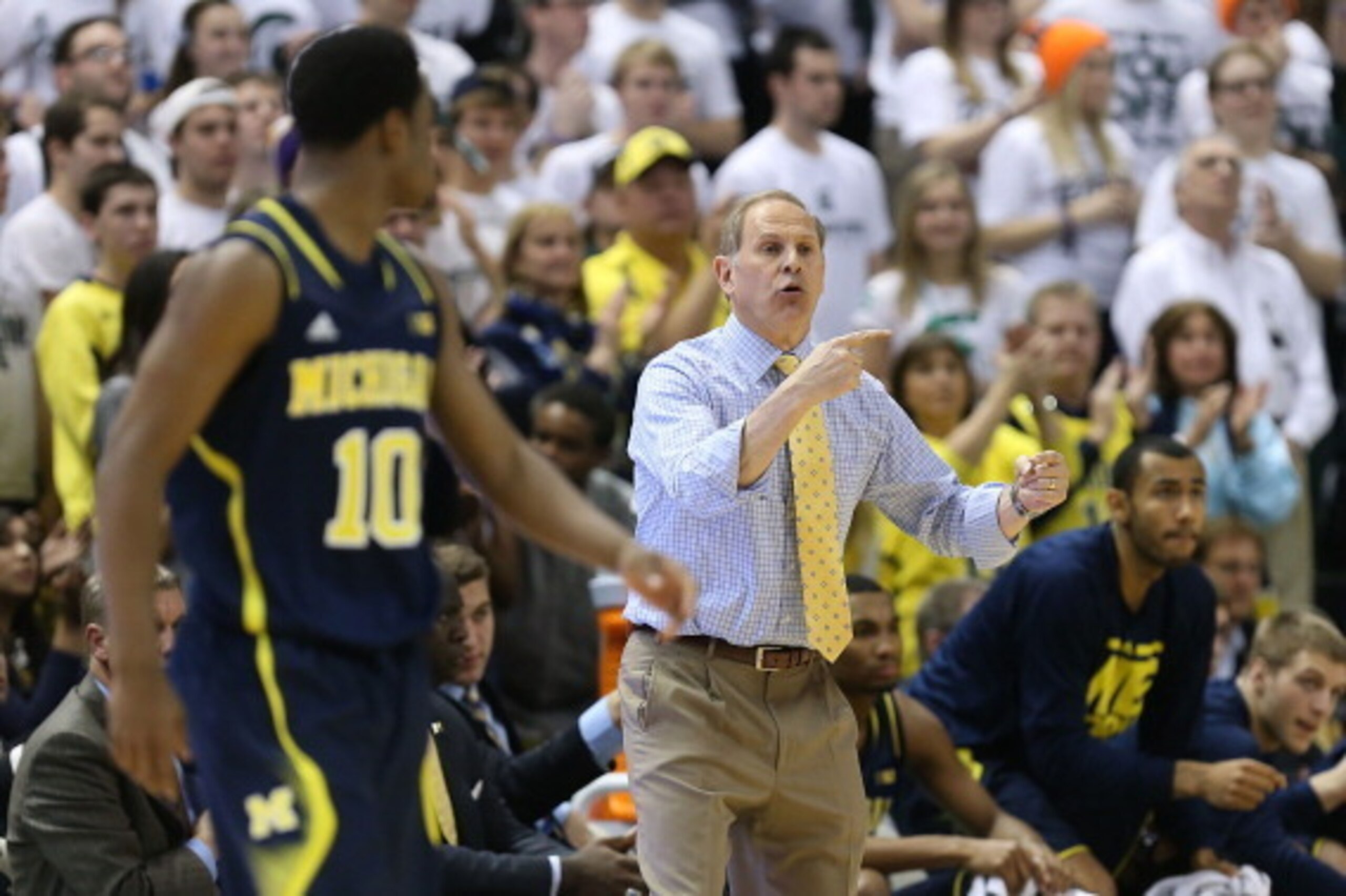 EAST LANSING, MI - JANUARY 25: Michigan Wolverines head basketball coach John Beilein shouts out instructions during the second half of the game against the Michigan State Spartans at Breslin Center on January 25, 2014 in East Lansing, Michigan. The Wolve