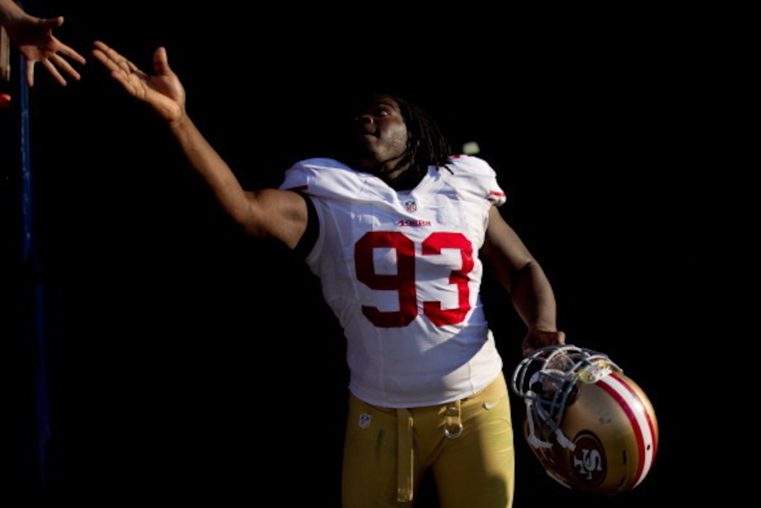 DENVER, CO - AUGUST 26: Defensive tackle Ian Williams #93 of the San Francisco 49ers shakes a fan's hand on his way to the locker room after defeating the Denver Broncos 29-24 in a pre-season game at Sports Authority Field Field at Mile High on August 26 DENVER, CO - AUGUST 26: Defensive tackle Ian Williams #93 of the San Francisco 49ers shakes a fan's hand on his way to the locker room after defeating the Denver Broncos 29-24 in a pre-season game at Sports Authority Field Field at Mile High on August 26