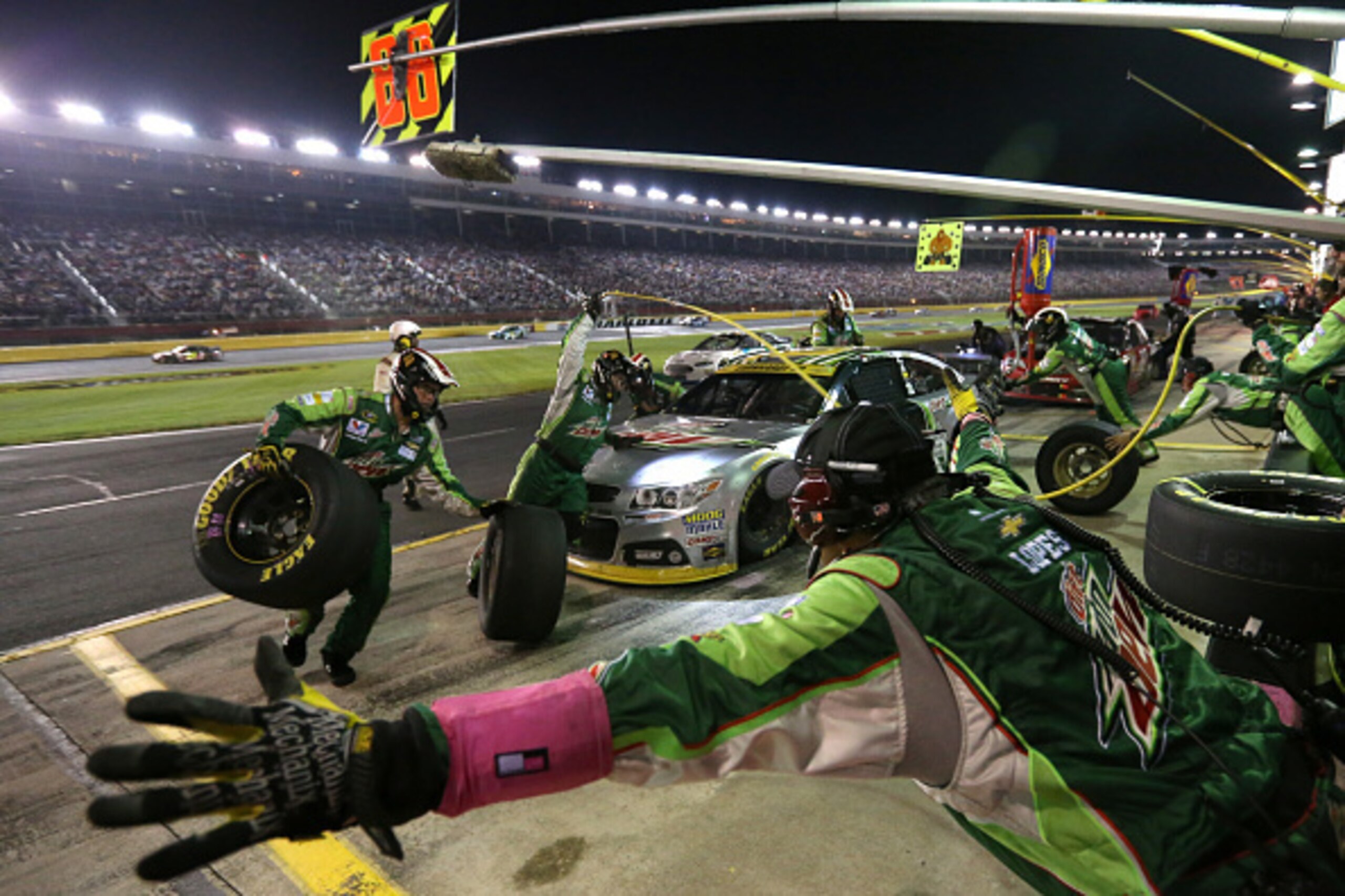 CHARLOTTE, NC - OCTOBER 11:  Dale Earnhardt Jr., driver of the #88 Diet Mountain Dew Chevrolet, pits during the NASCAR Sprint Cup Series Bank of America 500 at Charlotte Motor Speedway on October 11, 2014 in Charlotte, North Carolina.  (Photo by Sarah Gle