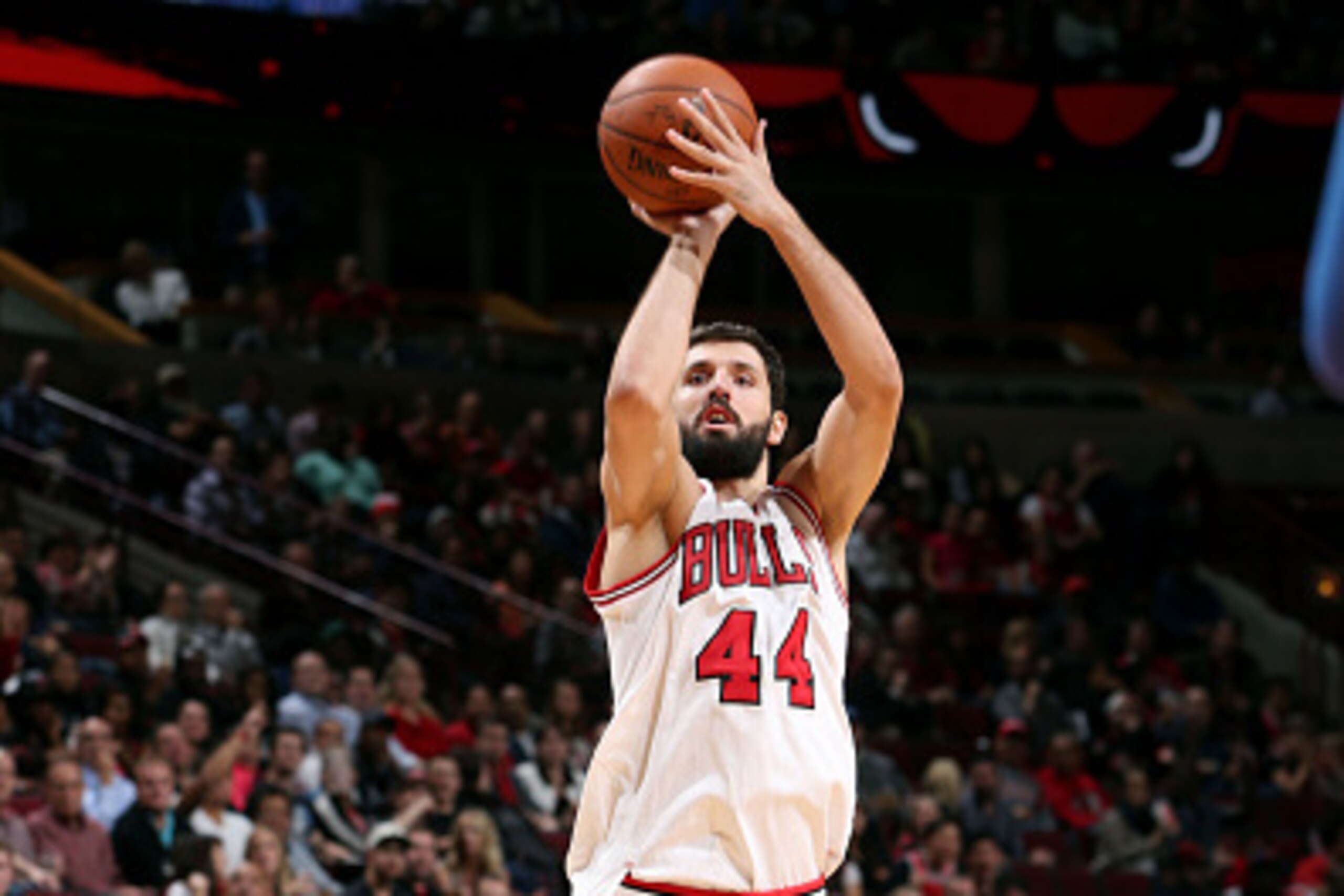 CHICAGO, IL - OCTOBER 13: Nikola Mirotic #44 of the Chicago Bulls shoots against the Denver Nuggets on October 13, 2014 at United Center, Chicago, Illinois. NOTE TO USER: User expressly acknowledges and agrees that, by downloading and or using this Photog