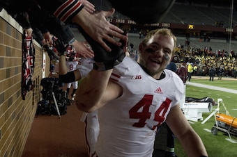 MINNEAPOLIS, MN - NOVEMBER 23: Chris Borland #44 of the Wisconsin Badgers celebrates a win of the game against the Minnesota Golden Gophers on November 23, 2013 at TCF Bank Stadium in Minneapolis, Minnesota. The Wisconsin Badgers defeated the Minnesota Go