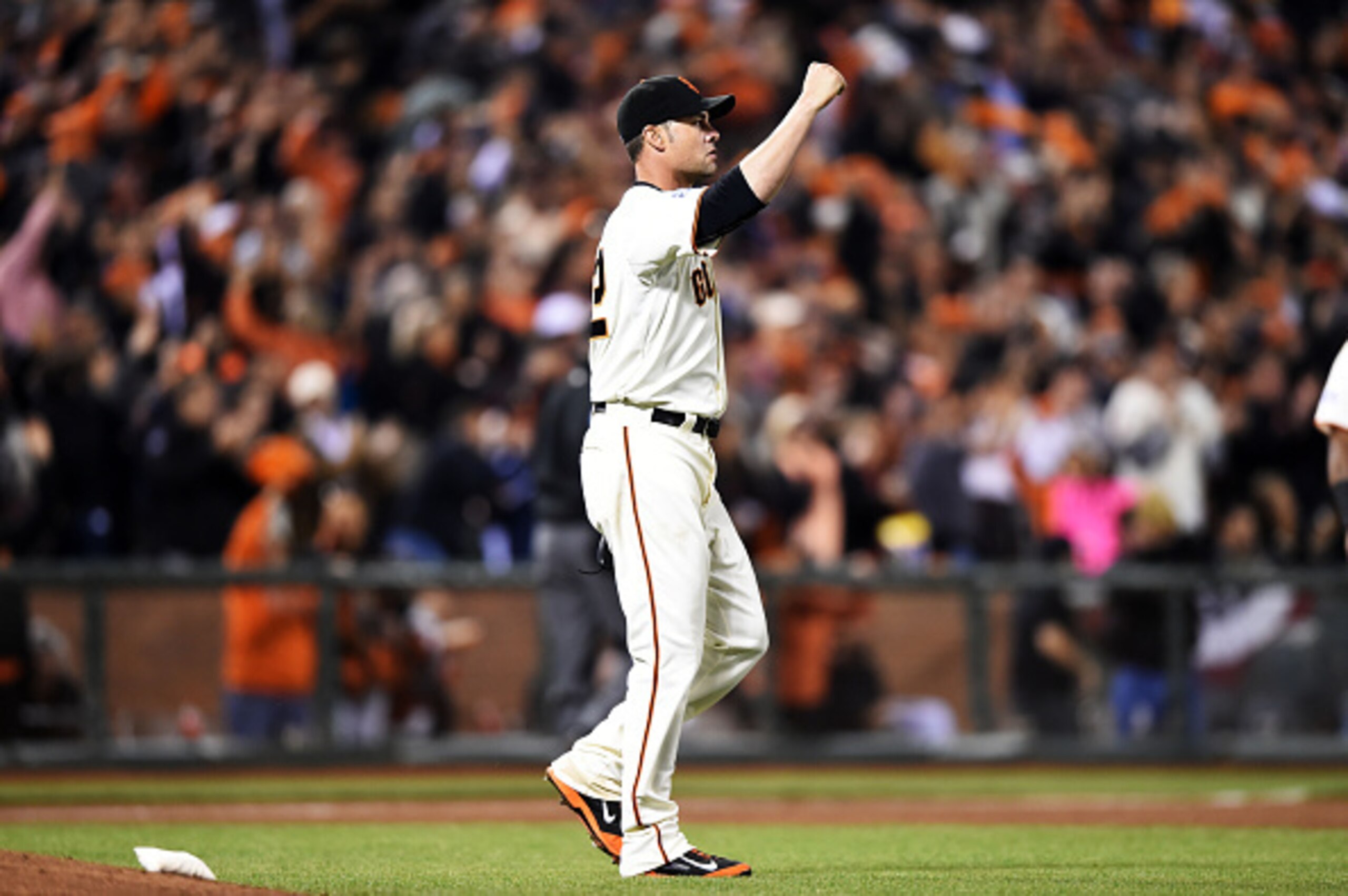SAN FRANCISCO, CA - OCTOBER 07:  Ryan Vogelsong #32 of the San Francisco Giants reacts after Hunter Pence #8 caught a ball hit by Jayson Werth #28 of the Washington Nationals for an out in the sixth inning during Game Four of the National League Division 