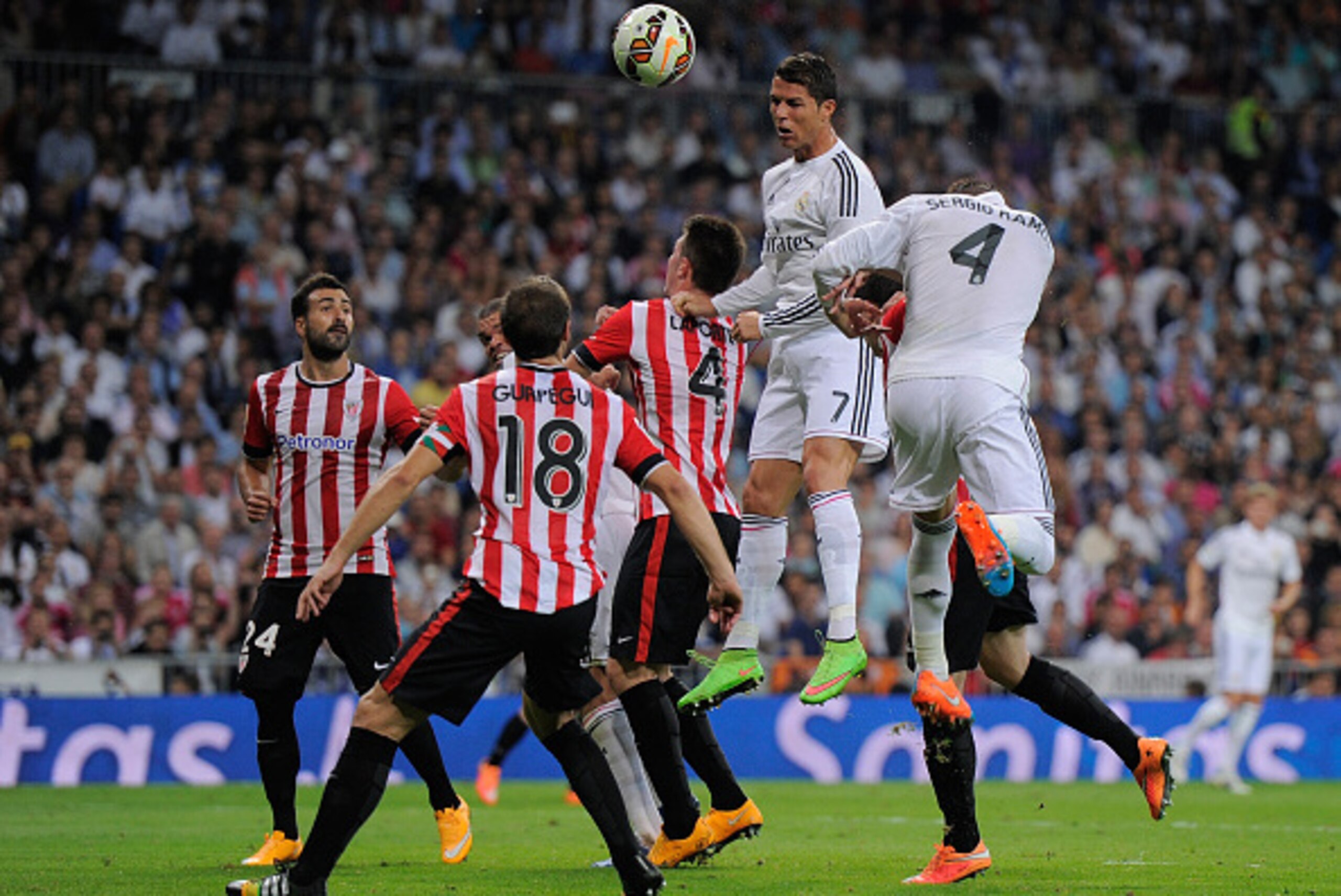 MADRID, SPAIN - OCTOBER 05: Cristiano Ronaldo of Real Madrid heads the ball beside Aymeric Laporte of Club Athletic during the La Liga match between Real Madrid CF and Athletic Club at Estadio Santiago Bernabeu on October 5, 2014 in Madrid, Spain. (Phot MADRID, SPAIN - OCTOBER 05: Cristiano Ronaldo of Real Madrid heads the ball beside Aymeric Laporte of Club Athletic during the La Liga match between Real Madrid CF and Athletic Club at Estadio Santiago Bernabeu on October 5, 2014 in Madrid, Spain. (Phot