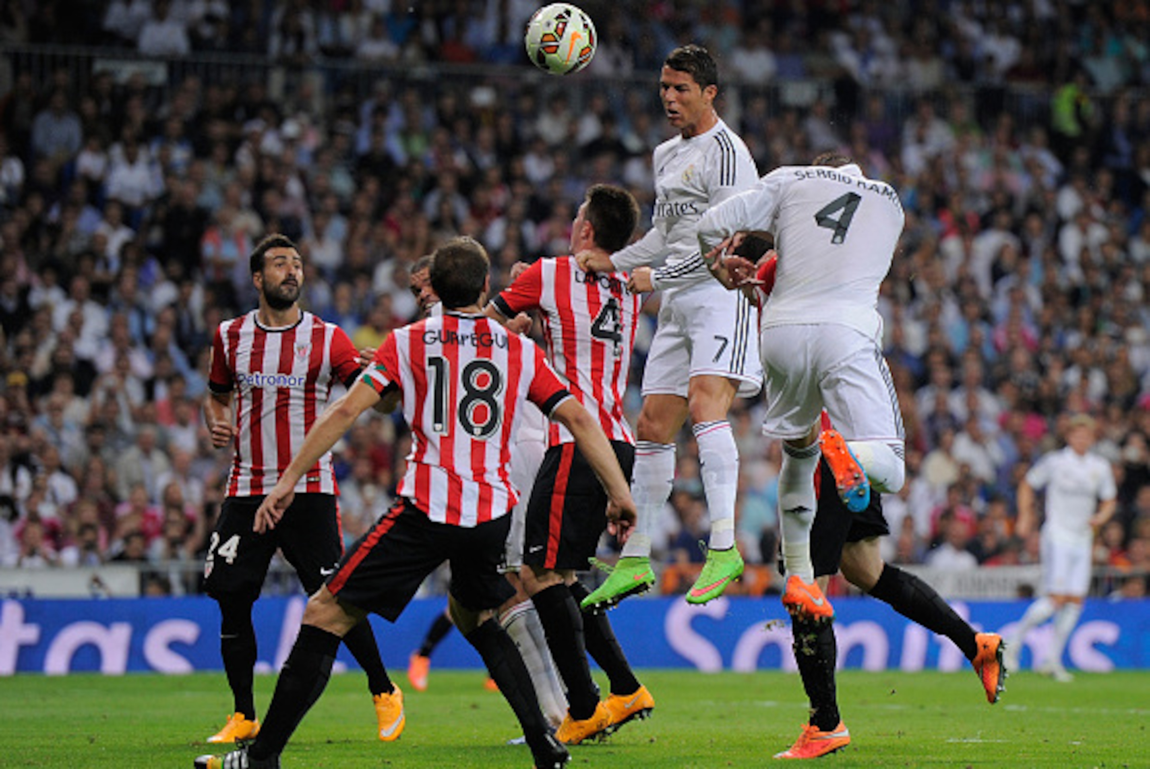 MADRID, SPAIN - OCTOBER 05:  Cristiano Ronaldo of Real Madrid heads the ball beside Aymeric Laporte of Club Athletic during the La Liga match between Real Madrid CF and Athletic Club at Estadio Santiago Bernabeu on October 5, 2014 in Madrid, Spain.  (Phot