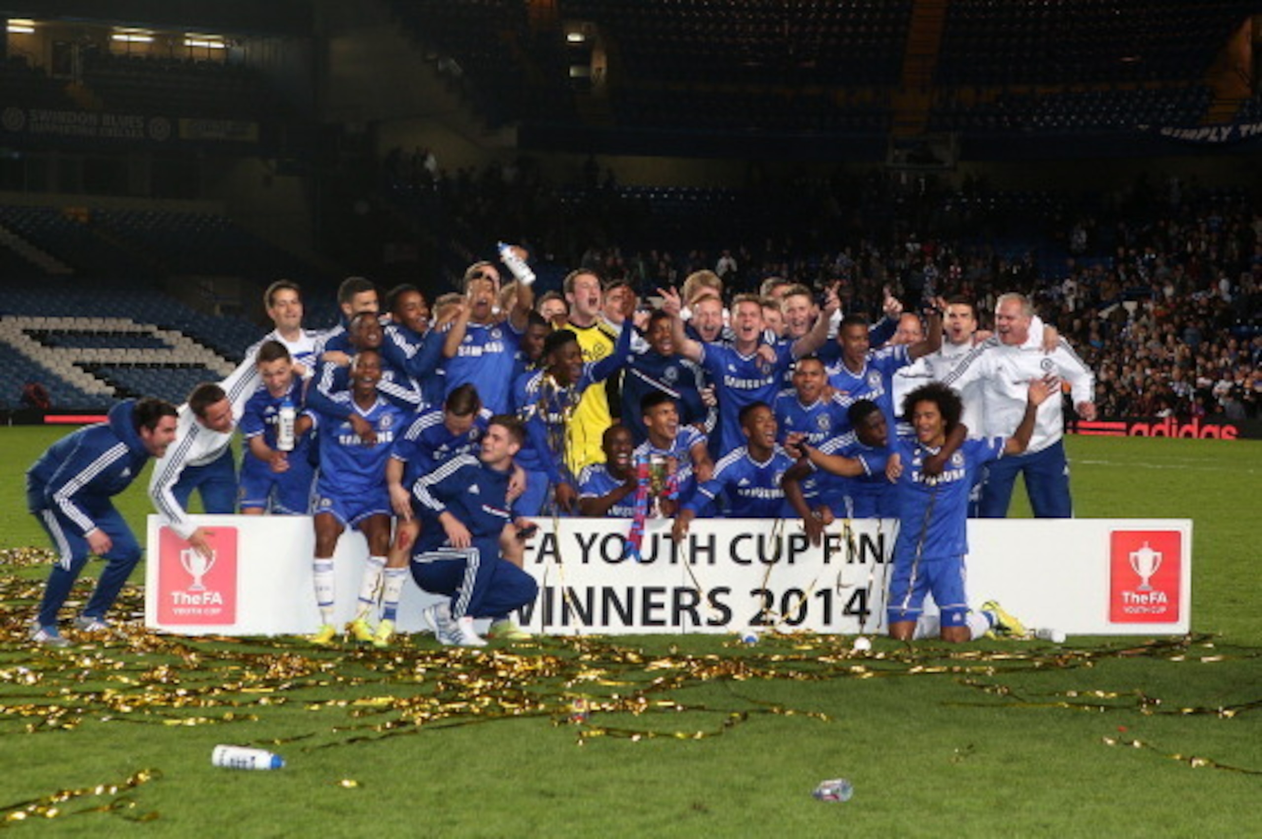 LONDON, ENGLAND - MAY 05: The Chelsea U18 team celebrate with the trophy after winning during the FA Youth Cup Final: Second Leg match between Chelsea v Fulahm at Stamford Bridge on May 05, 2014 in London, England. (Photo by Charlie Crowhurst/Getty Images