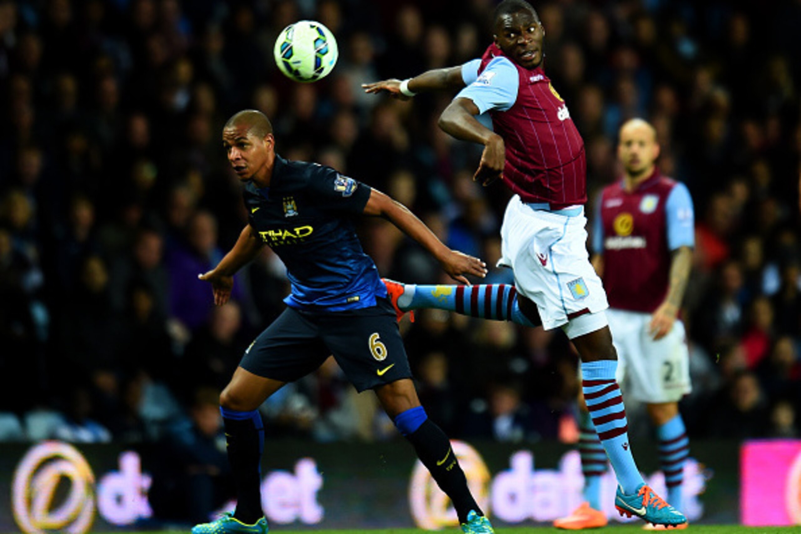 BIRMINGHAM, ENGLAND - OCTOBER 04:  Christian Benteke of Aston Villa battles for the ball with Fernando of Manchester City during the Barclays Premier League match between Aston Villa and Manchester City at Villa Park on October 4, 2014 in Birmingham, Engl
