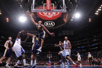 LOS ANGELES, CA - OCTOBER 23: Rudy Gobert #27 of the Utah Jazz blocks a shot against the Los Angeles Clippers at Staples Center on October 23, 2013 in Los Angeles, California. NOTE TO USER: User expressly acknowledges and agrees that, by downloading and/o