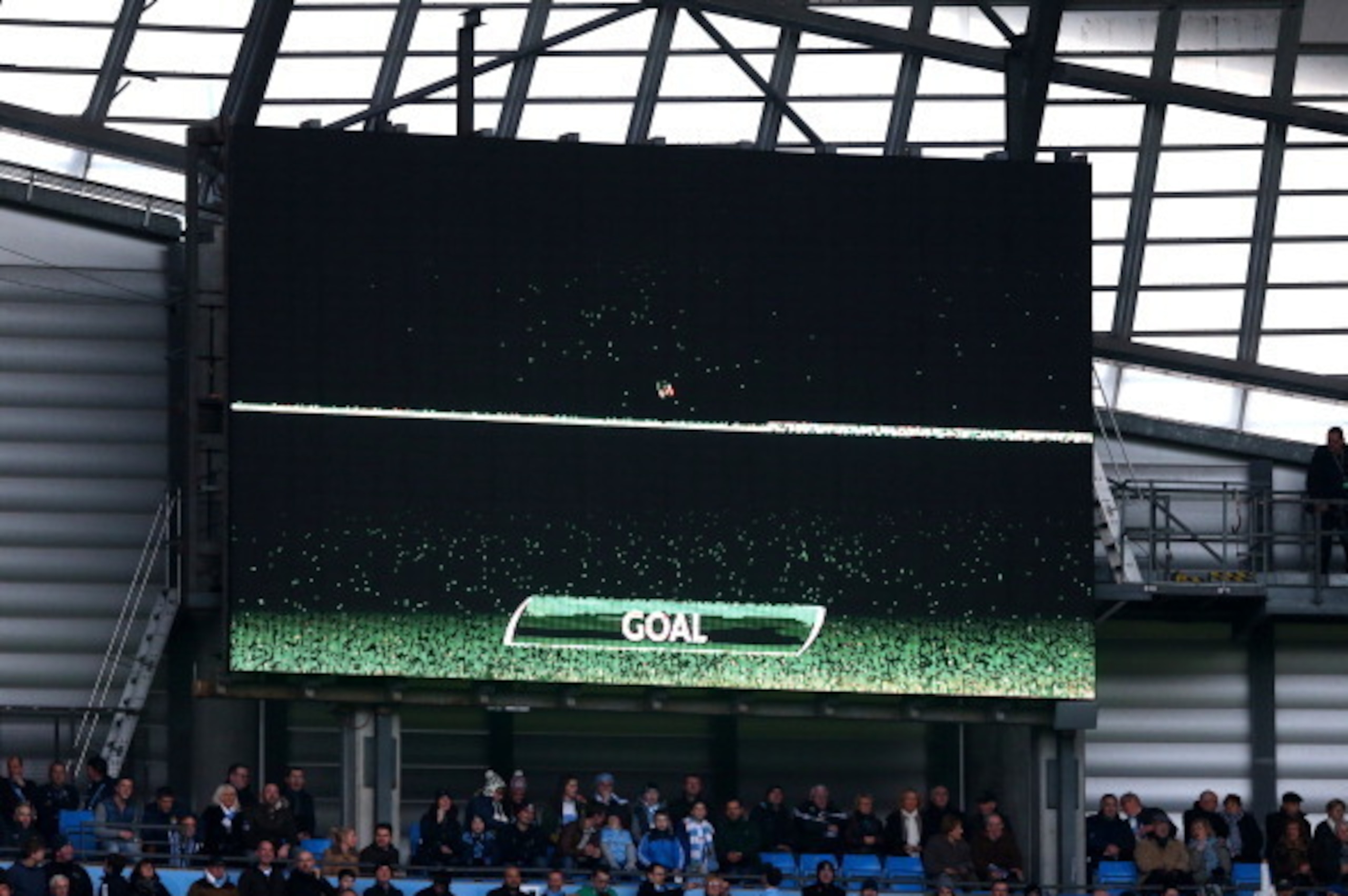 The opening goal scored by Edin Dzeko of Manchester City, the first in the Premier League to be awarded using goal line technology is displayed on the scoreboard during the Barclays Premier League match between Manchester City and Cardiff City at the Etih