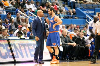 HARTFORD, CT - OCTOBER 8: Head coach Derek Fisher and Jose Calderon #3 of the New York Knicks speak during the game against the Boston Celtics during a preseason game at the XL Center on October 8, 2014 in Hartford, Connecticut. NOTE TO USER: User express